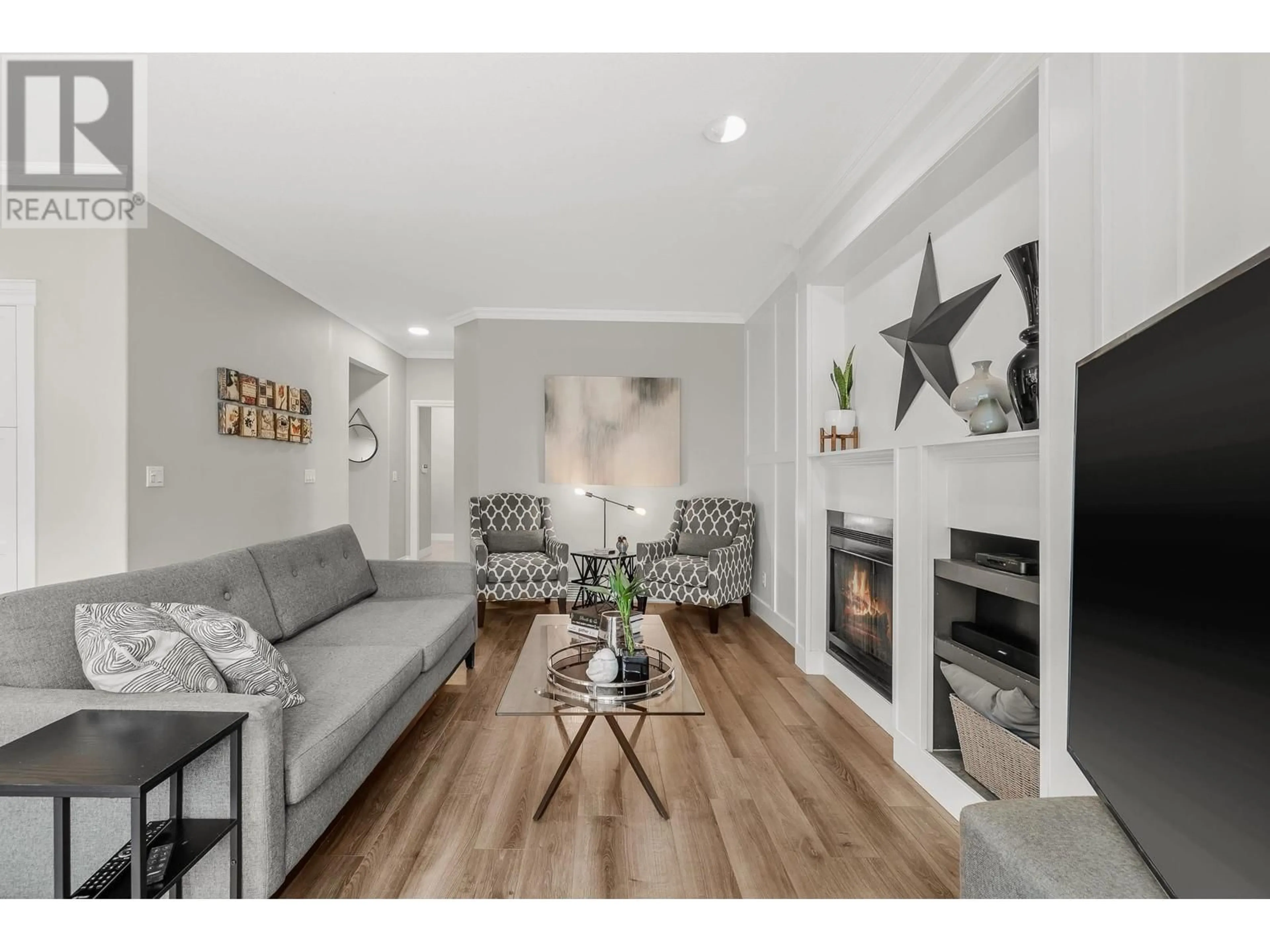 Living room with furniture, wood/laminate floor for 34 FOXWOOD DRIVE, Port Moody British Columbia V3H4X3