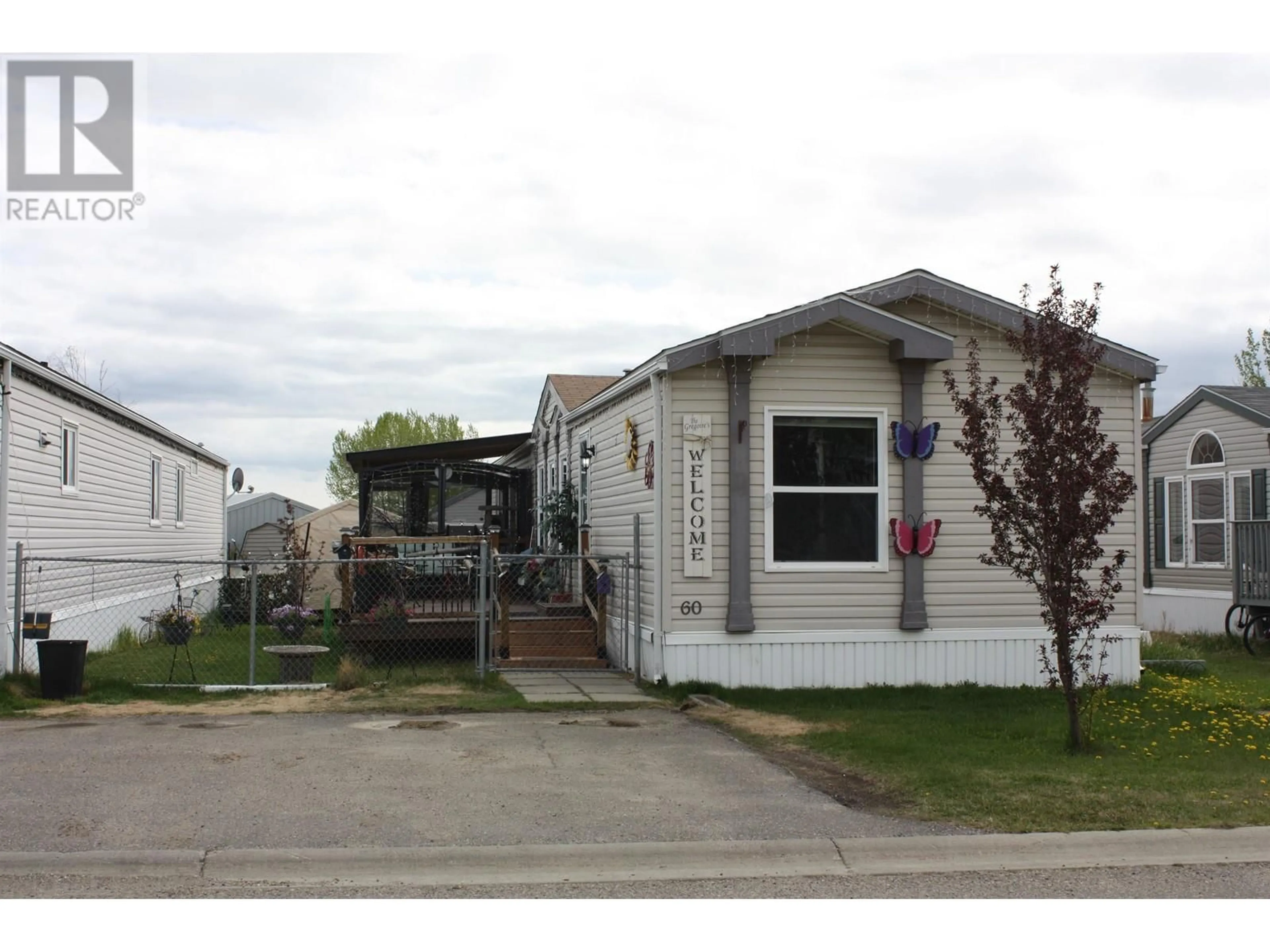 Home with vinyl exterior material, street for 60 - 9203 82 STREET, Fort St. John British Columbia V1J5G5
