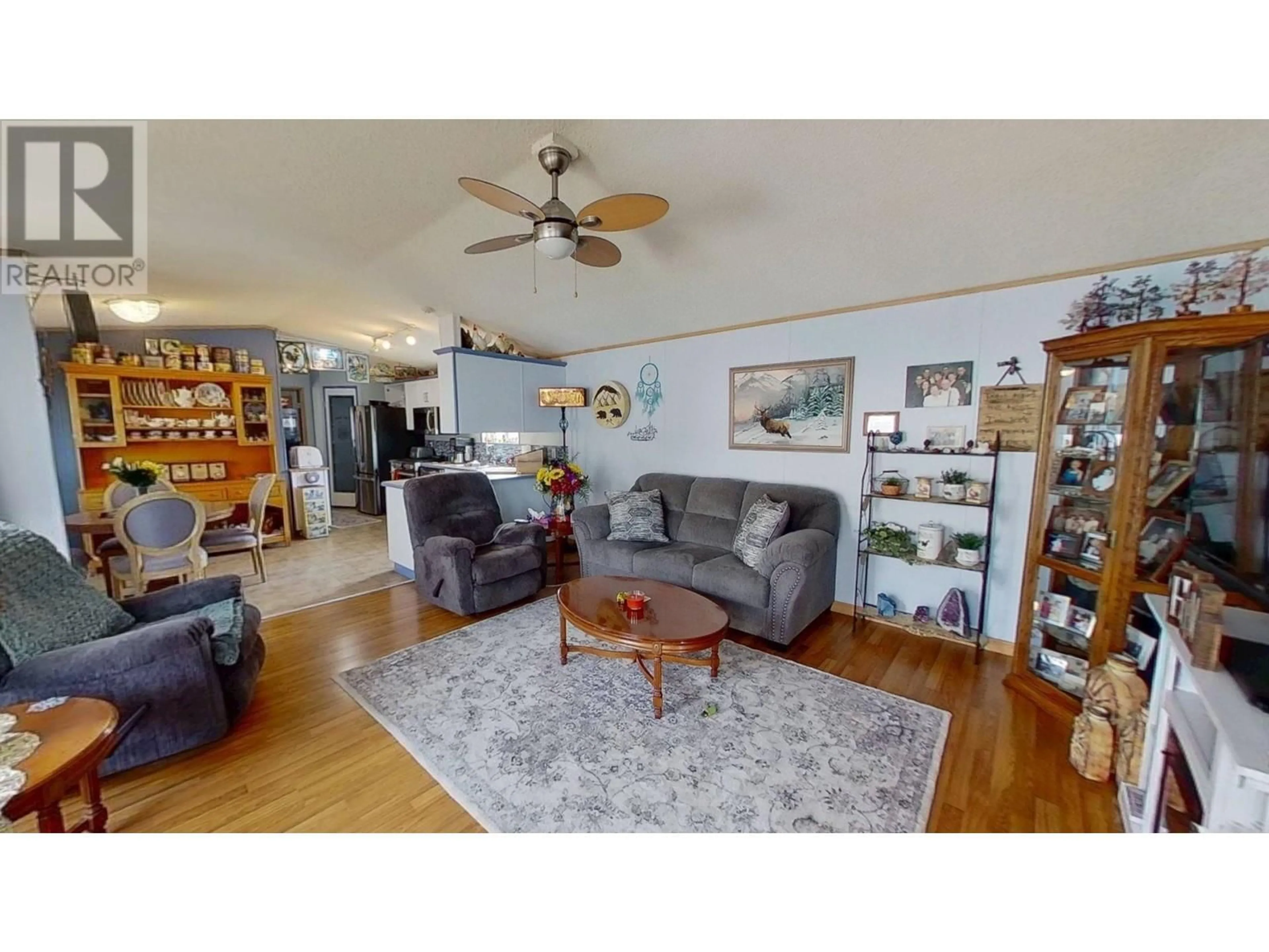 Living room with furniture, wood/laminate floor for 60 - 9203 82 STREET, Fort St. John British Columbia V1J5G5