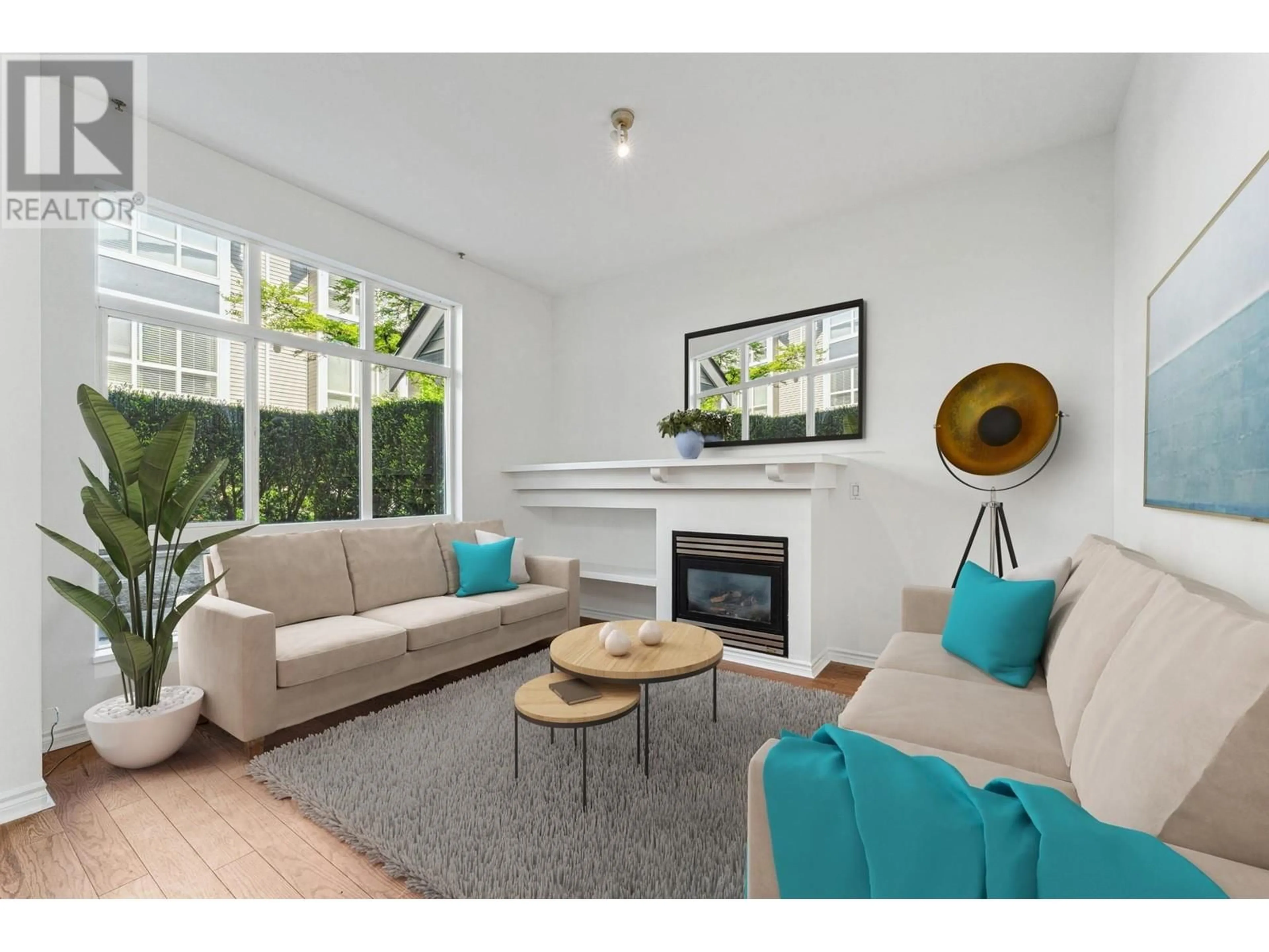 Living room with furniture, wood/laminate floor for 1 - 995 LYNN VALLEY ROAD, North Vancouver British Columbia V7J1Z6