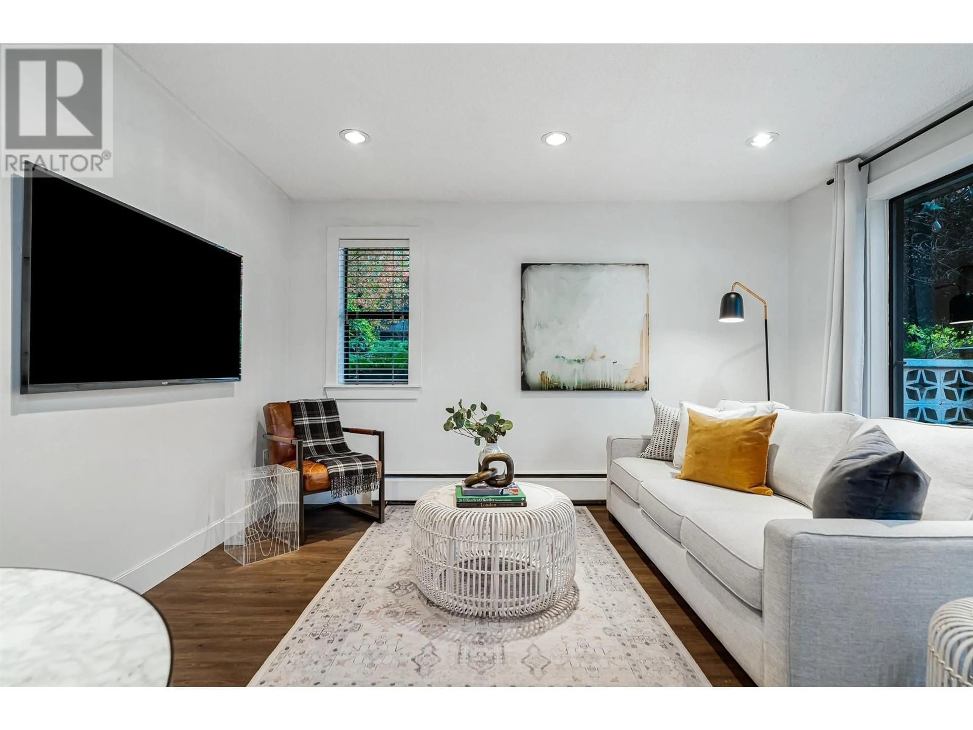 Living room with furniture, wood/laminate floor for 107 - 1611 3RD AVENUE, Vancouver British Columbia V5N1H1