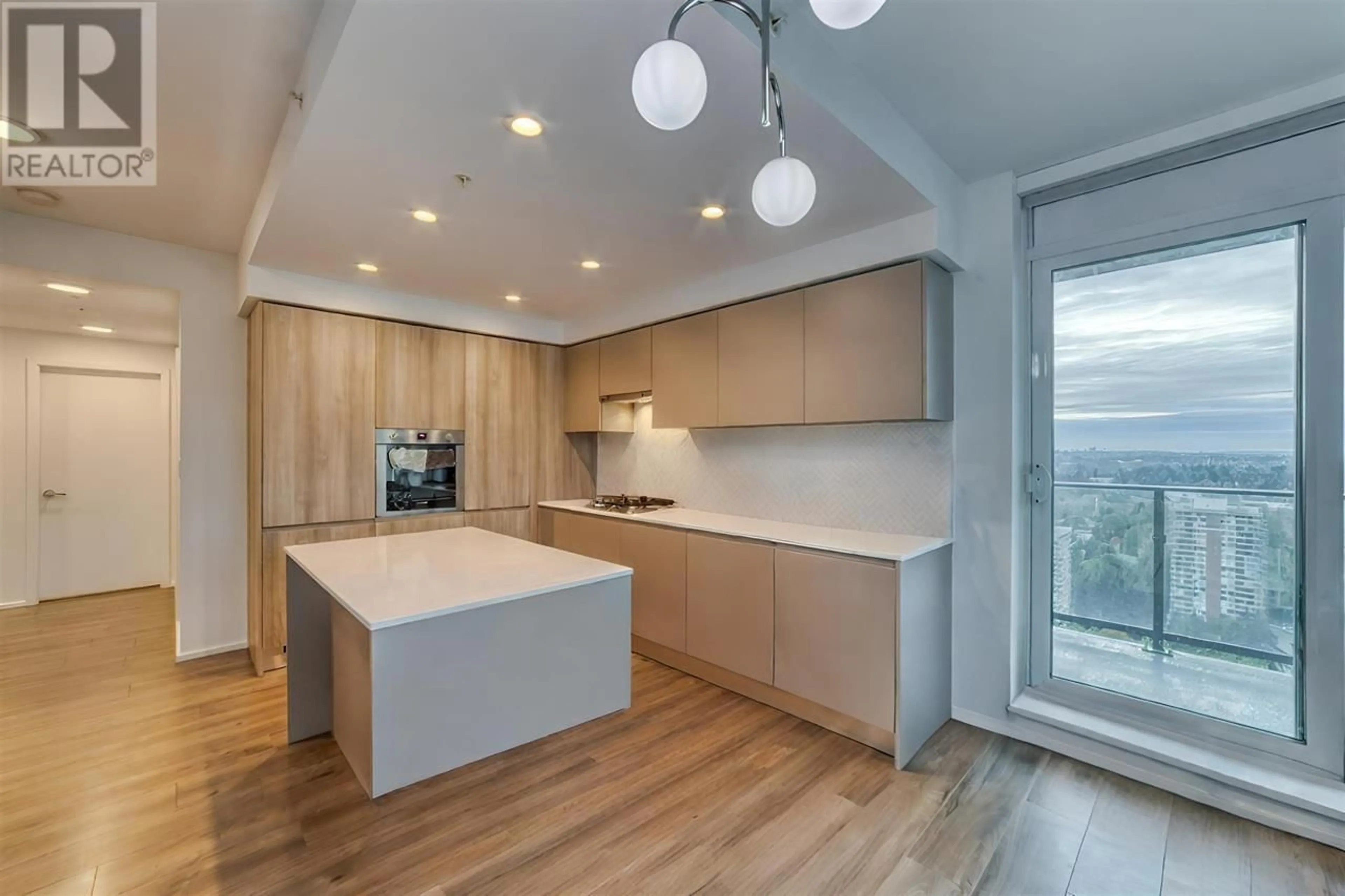 Open concept kitchen, wood/laminate floor for 2710 - 3809 EVERGREEN PLACE, Burnaby British Columbia V3J0M1