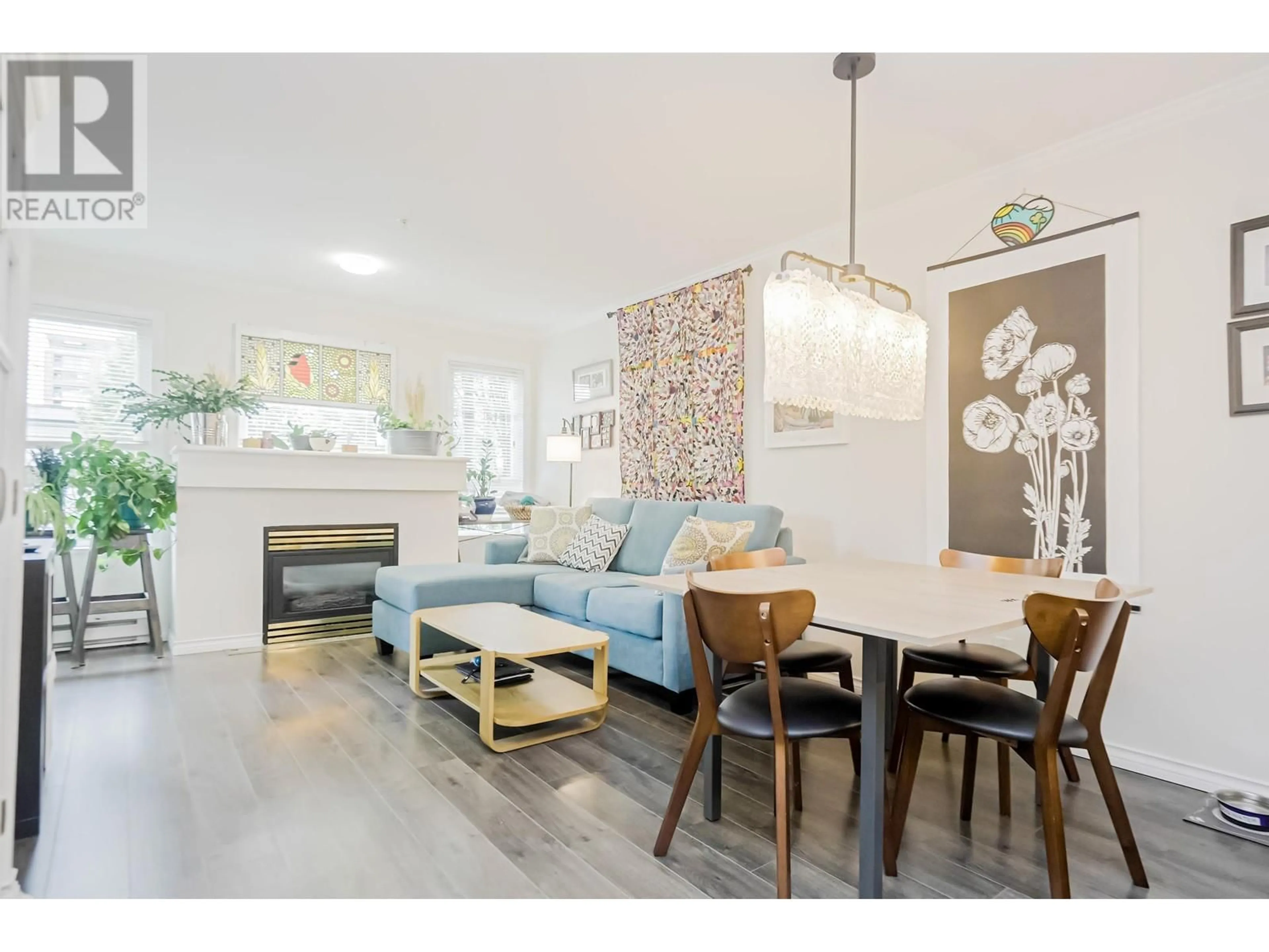 Living room with furniture, wood/laminate floor for 303 - 4989 DUCHESS STREET, Vancouver British Columbia V5R6E5