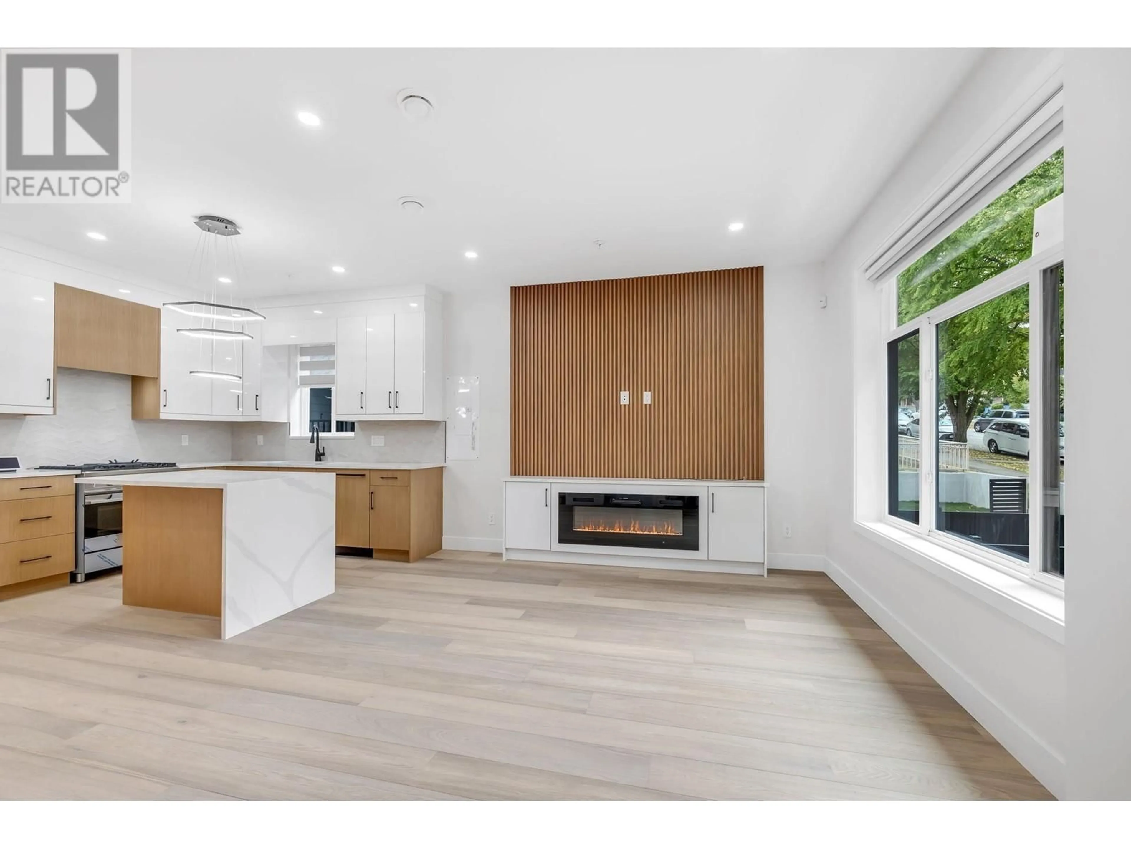 Open concept kitchen, wood/laminate floor for 3442 4TH AVENUE, Vancouver British Columbia V5M1L9