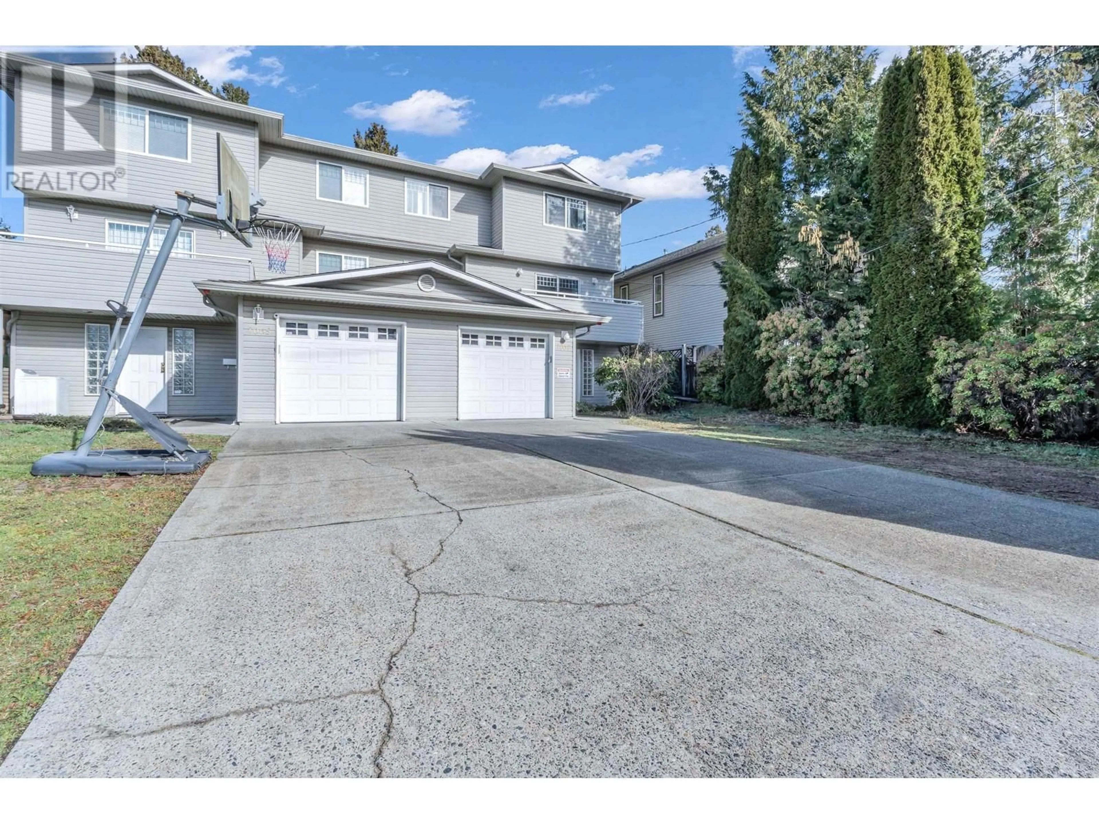 A pic from outside/outdoor area/front of a property/back of a property/a pic from drone, street for 1067 DANSEY AVENUE, Coquitlam British Columbia V3K3H2