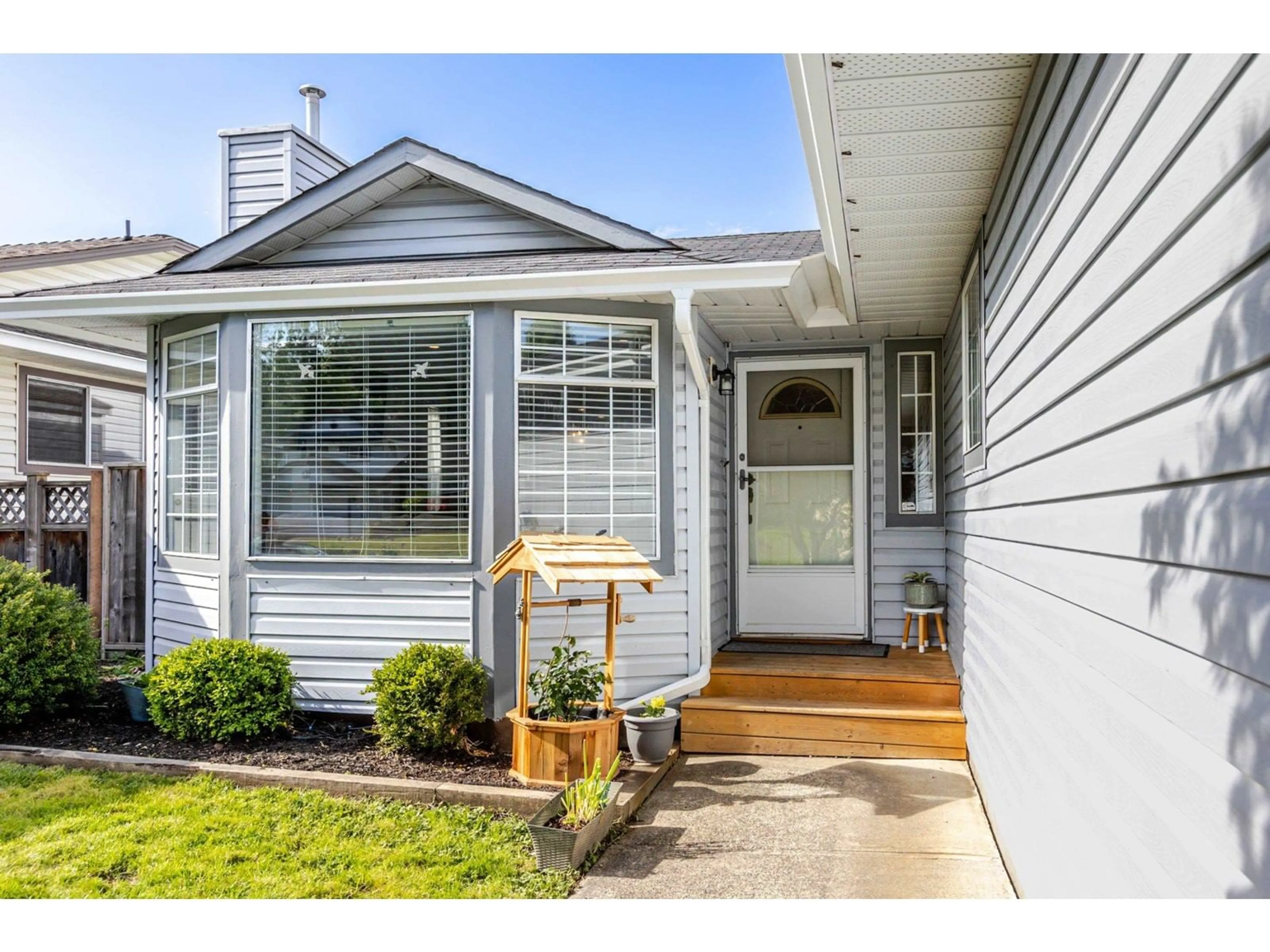 Home with vinyl exterior material, street for 21571 93B, Langley British Columbia V1M2A3