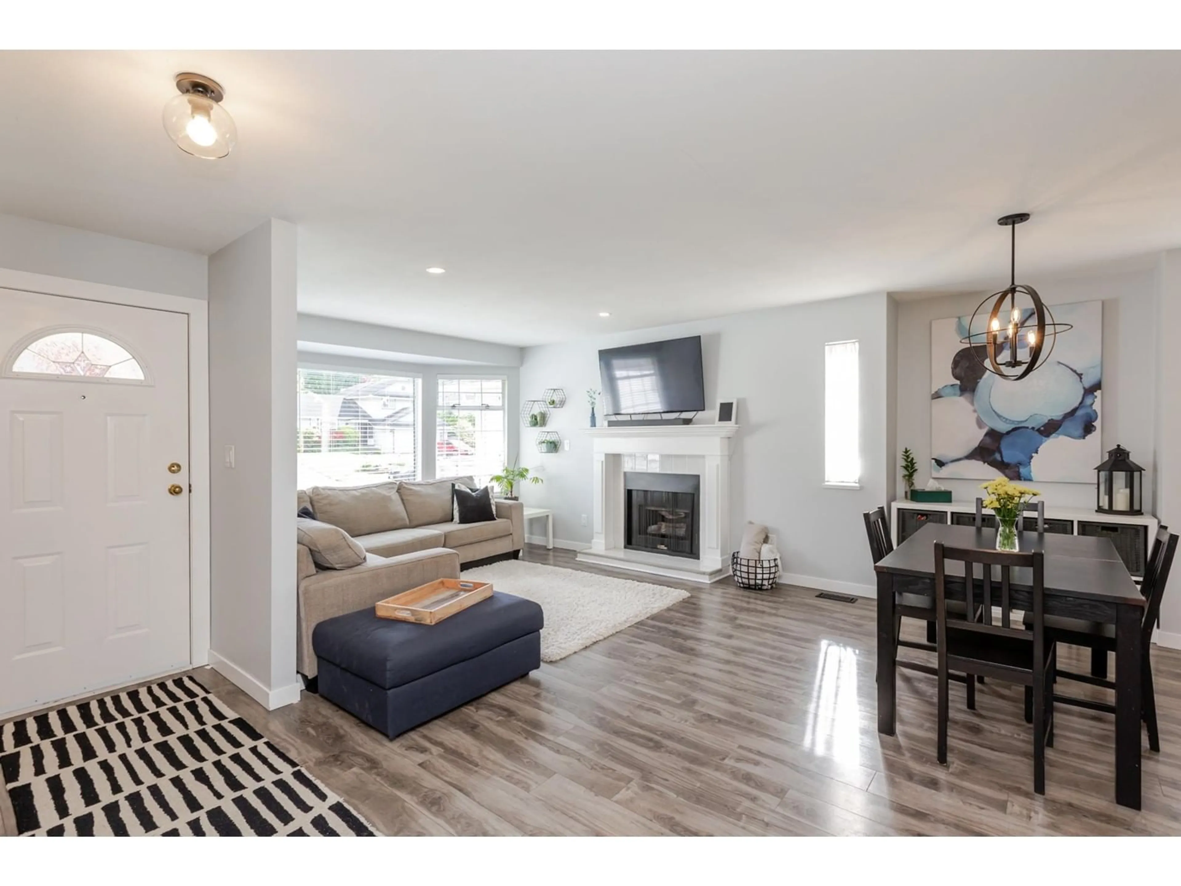 Living room with furniture, wood/laminate floor for 21571 93B, Langley British Columbia V1M2A3