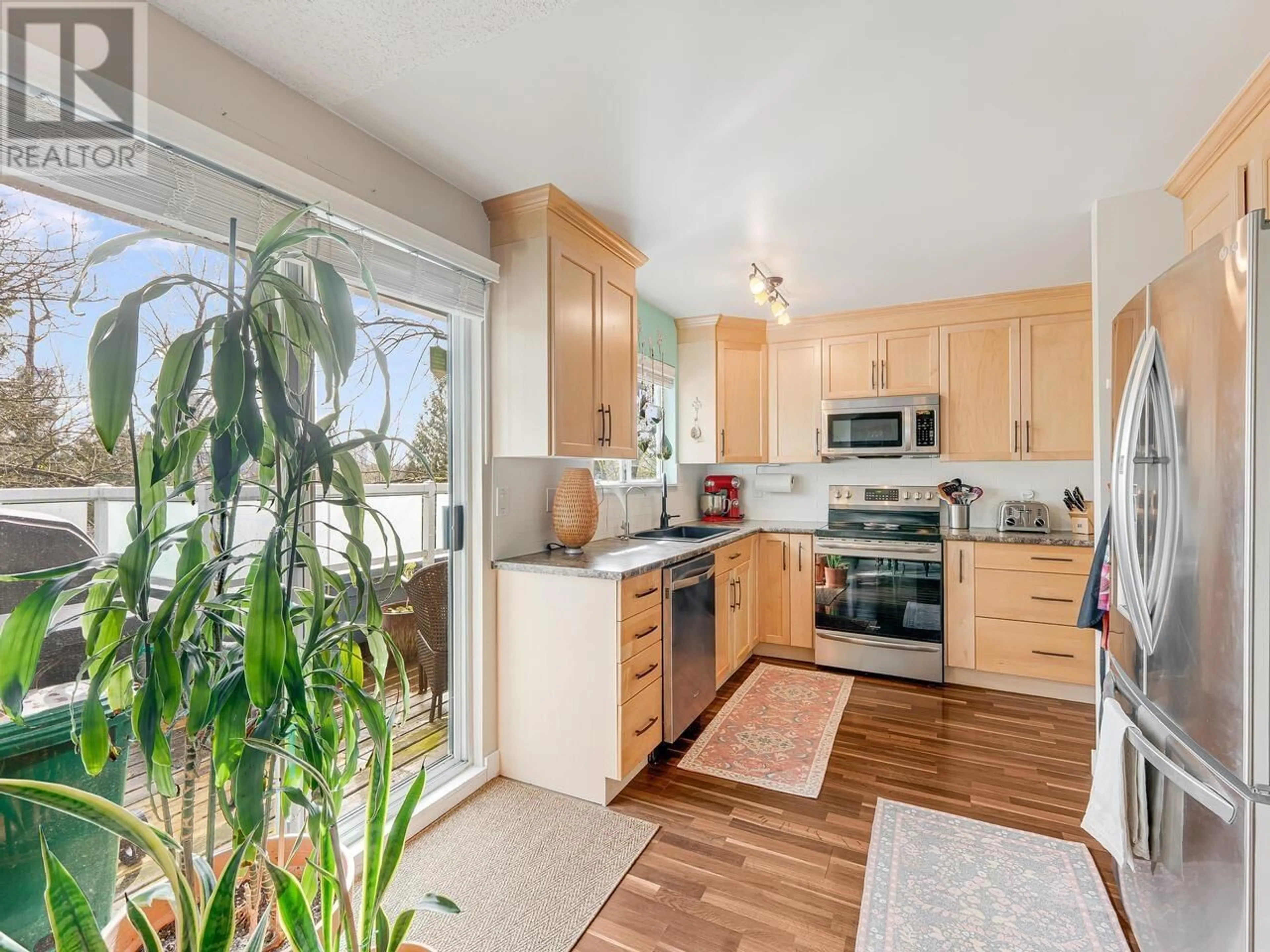 Open concept kitchen, unknown for 68 - 9000 ASH GROVE CRESCENT, Burnaby British Columbia V5A4M6