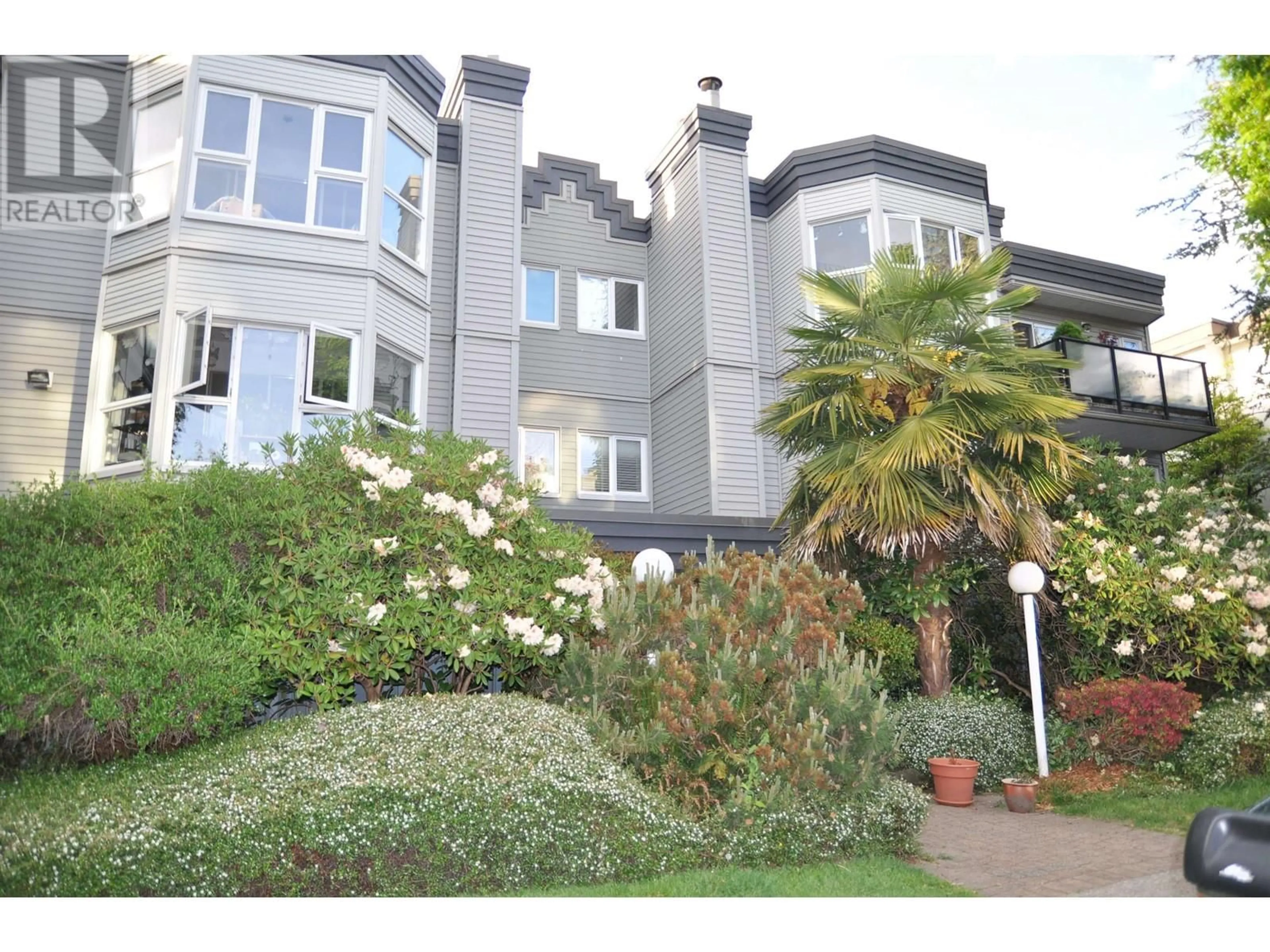 A pic from outside/outdoor area/front of a property/back of a property/a pic from drone, street for 104 - 2255 ETON STREET, Vancouver British Columbia V5L1C9