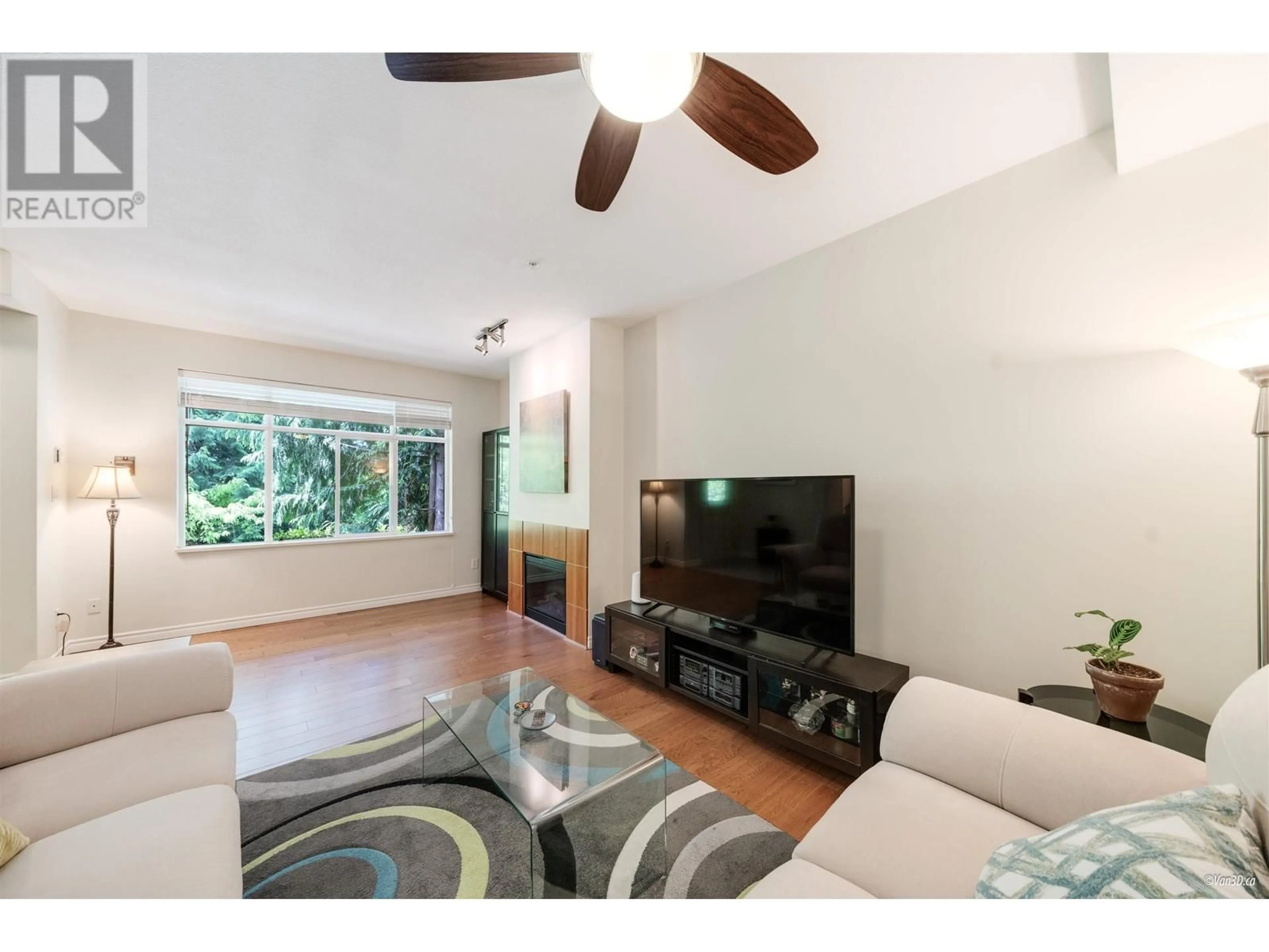 Living room with furniture, wood/laminate floor for 72 - 6878 SOUTHPOINT DRIVE, Burnaby British Columbia V3N5E4