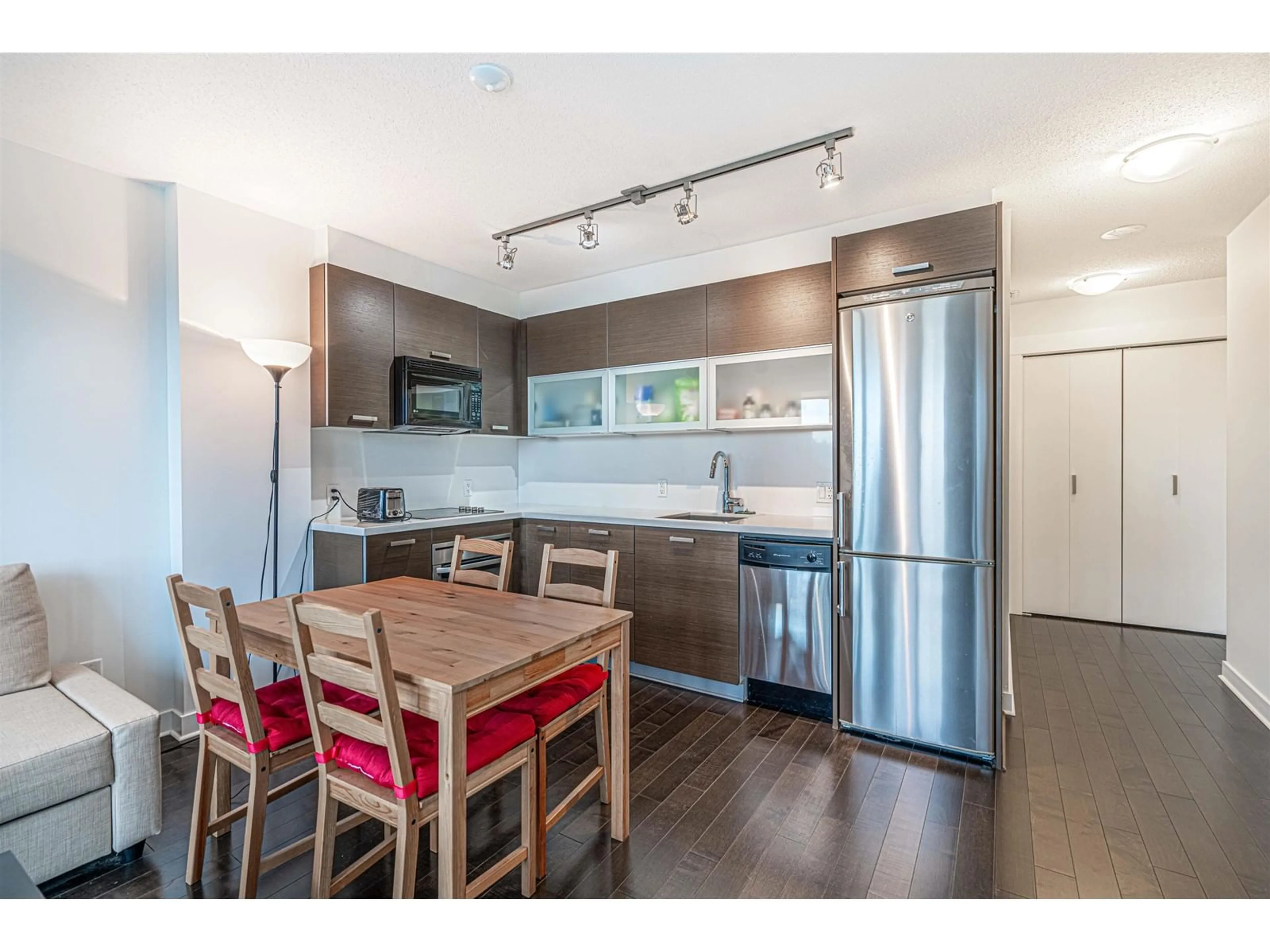 Open concept kitchen, wood/laminate floor for 1002 - 10777 UNIVERSITY, Surrey British Columbia V3T0E6