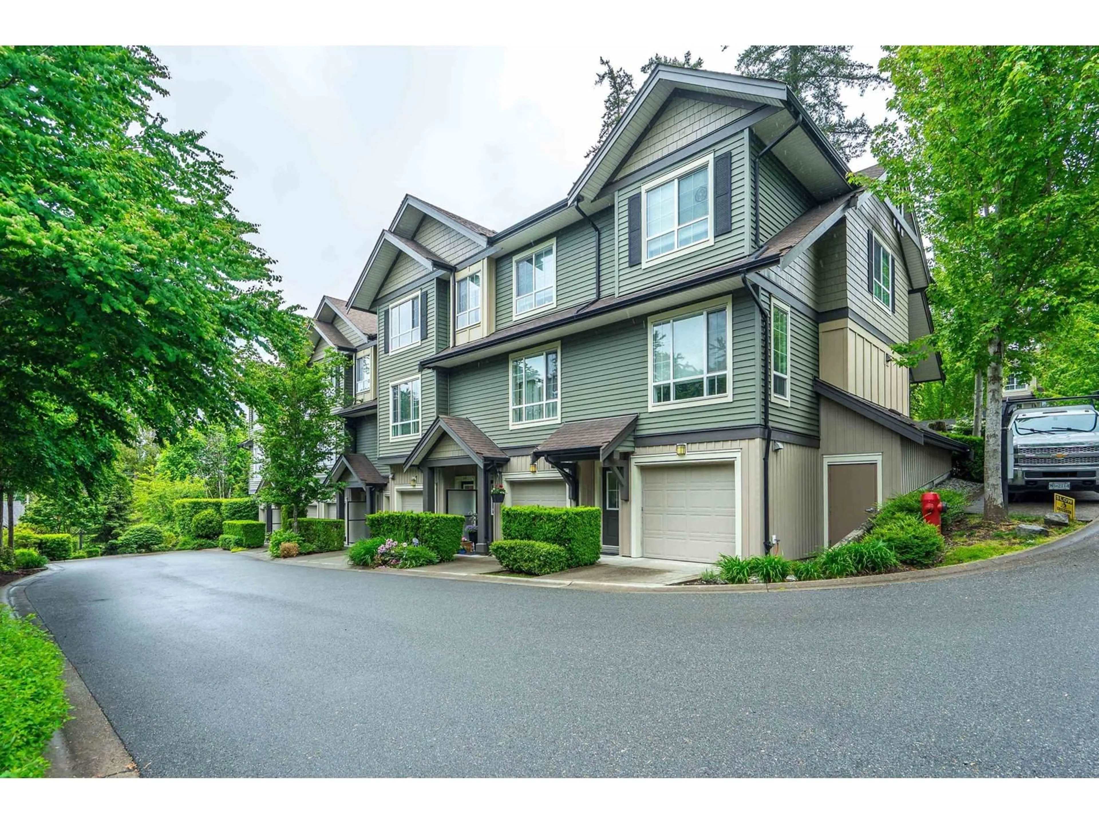 A pic from outside/outdoor area/front of a property/back of a property/a pic from drone, street for 44 - 4967 220, Langley British Columbia V3A0G3