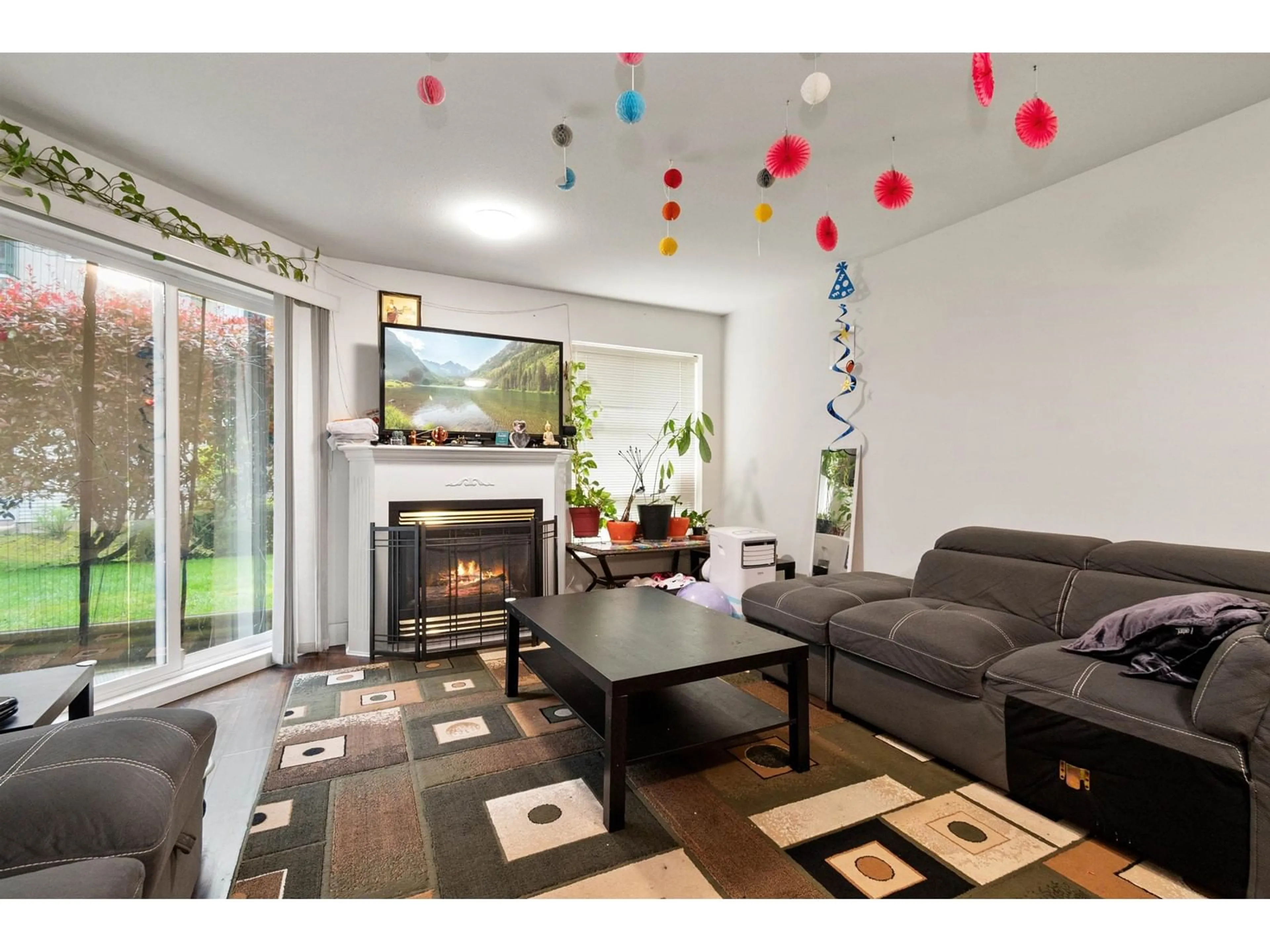 Living room with furniture, wood/laminate floor for 107 - 2435 CENTER, Abbotsford British Columbia V2T2N4