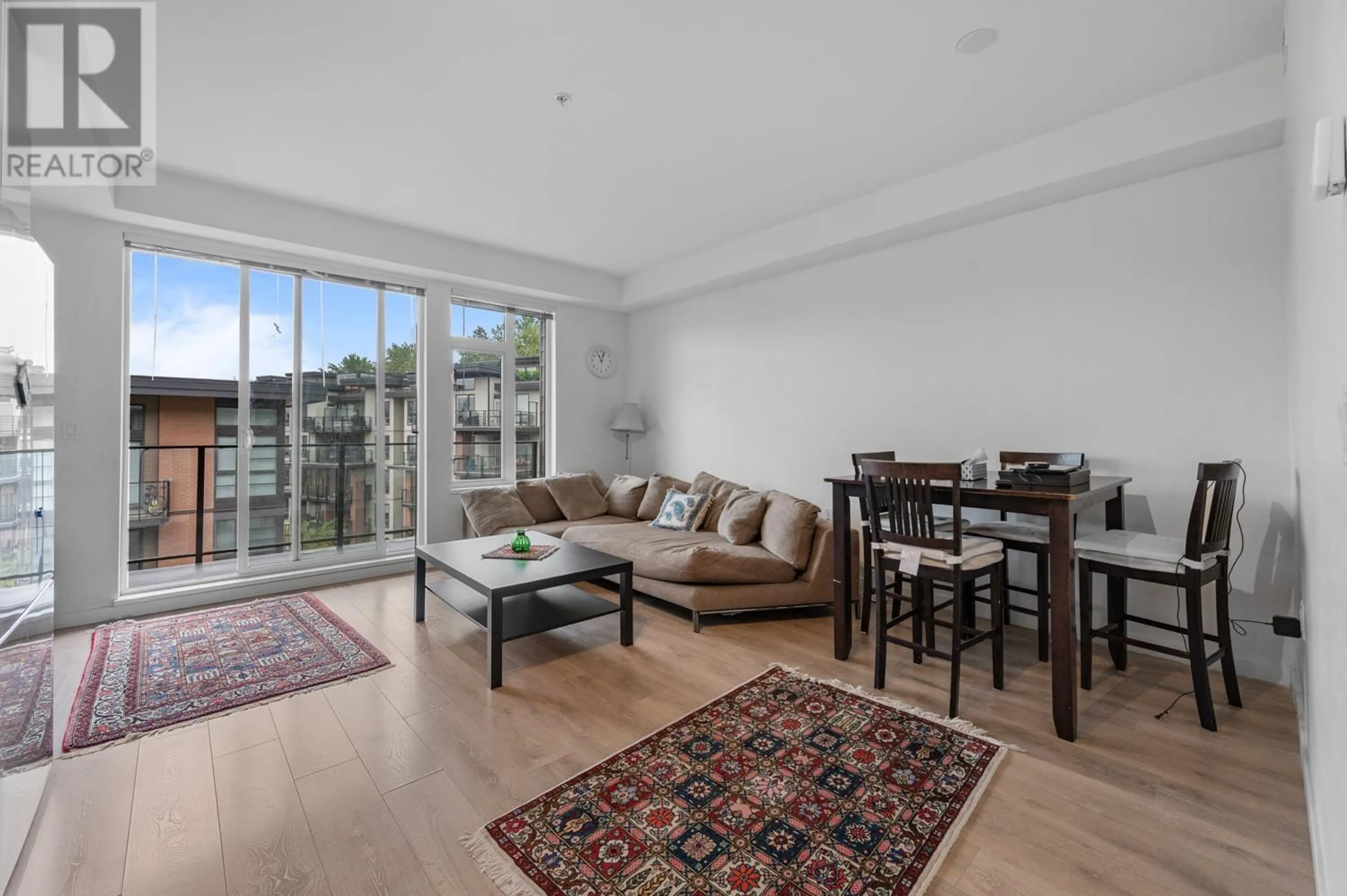 Living room with furniture, wood/laminate floor for 409 - 725 MARINE DRIVE, North Vancouver British Columbia V7M0G2