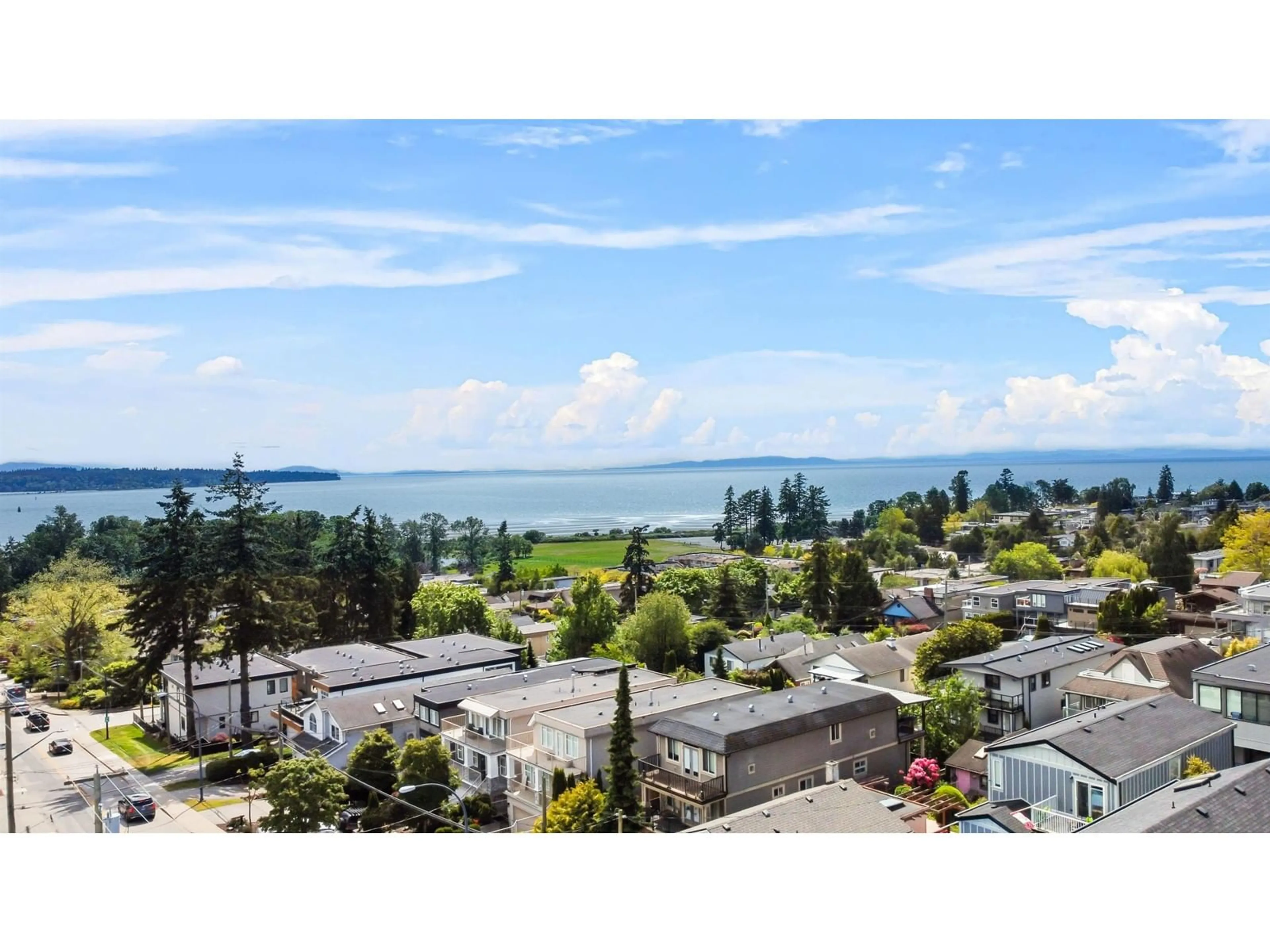 A pic from outside/outdoor area/front of a property/back of a property/a pic from drone, water/lake/river/ocean view for 16019 9A, Surrey British Columbia V4A4W5