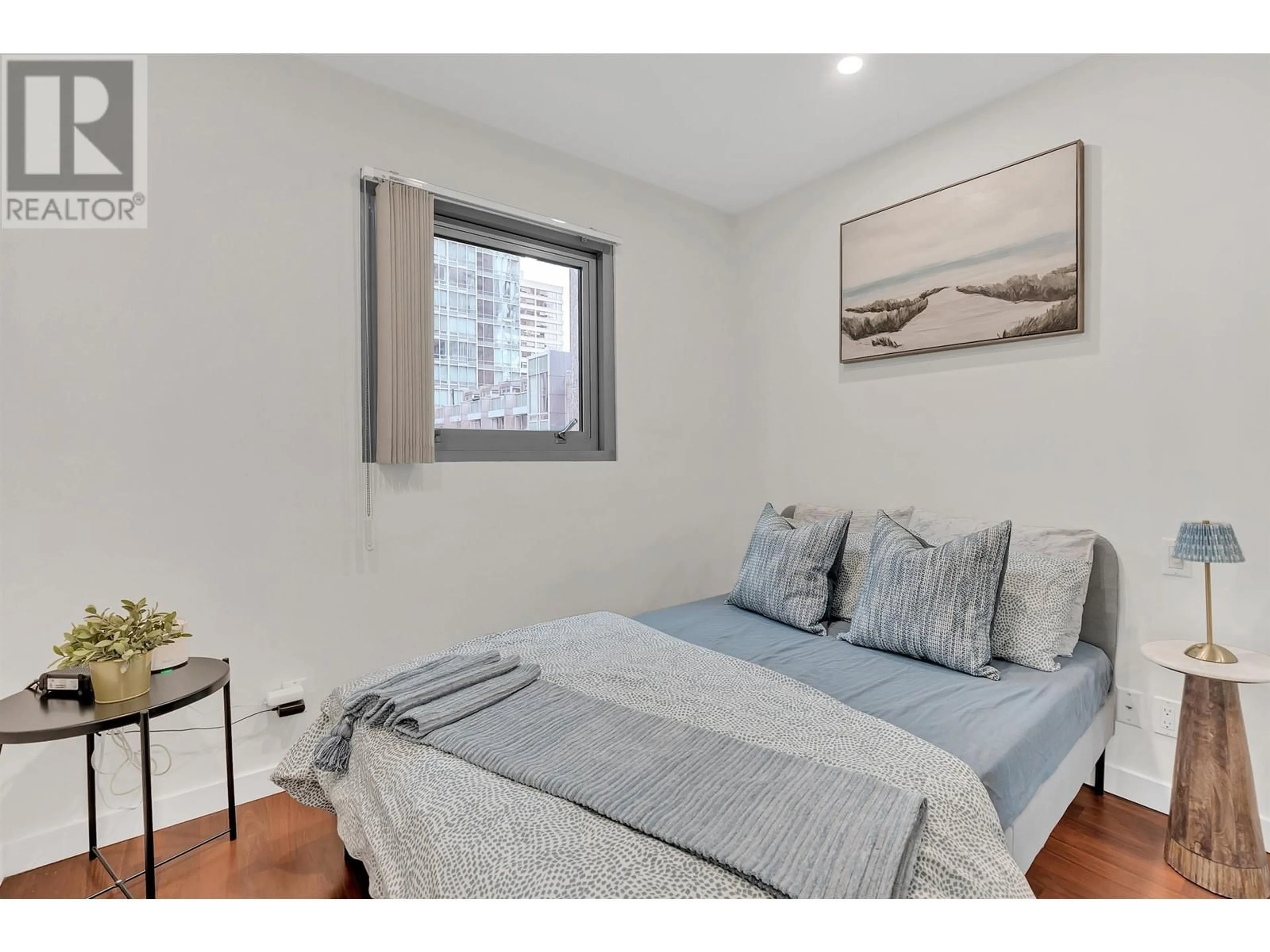 Bedroom with bed, wood/laminate floor for 304 - 1288 GEORGIA STREET, Vancouver British Columbia V6E4R3