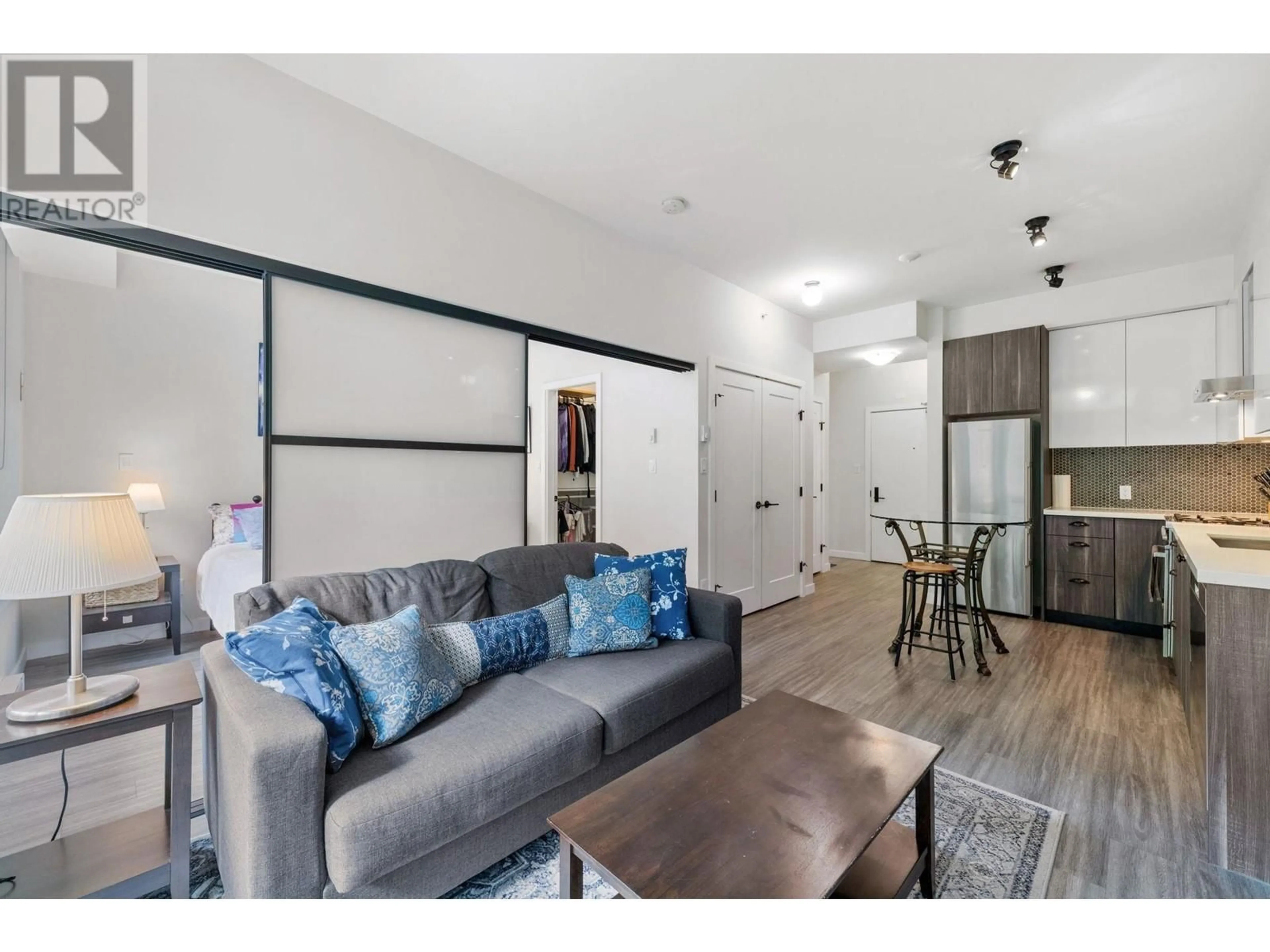 Living room with furniture, wood/laminate floor for 114 - 311 6TH STREET, Vancouver British Columbia V5T1J9