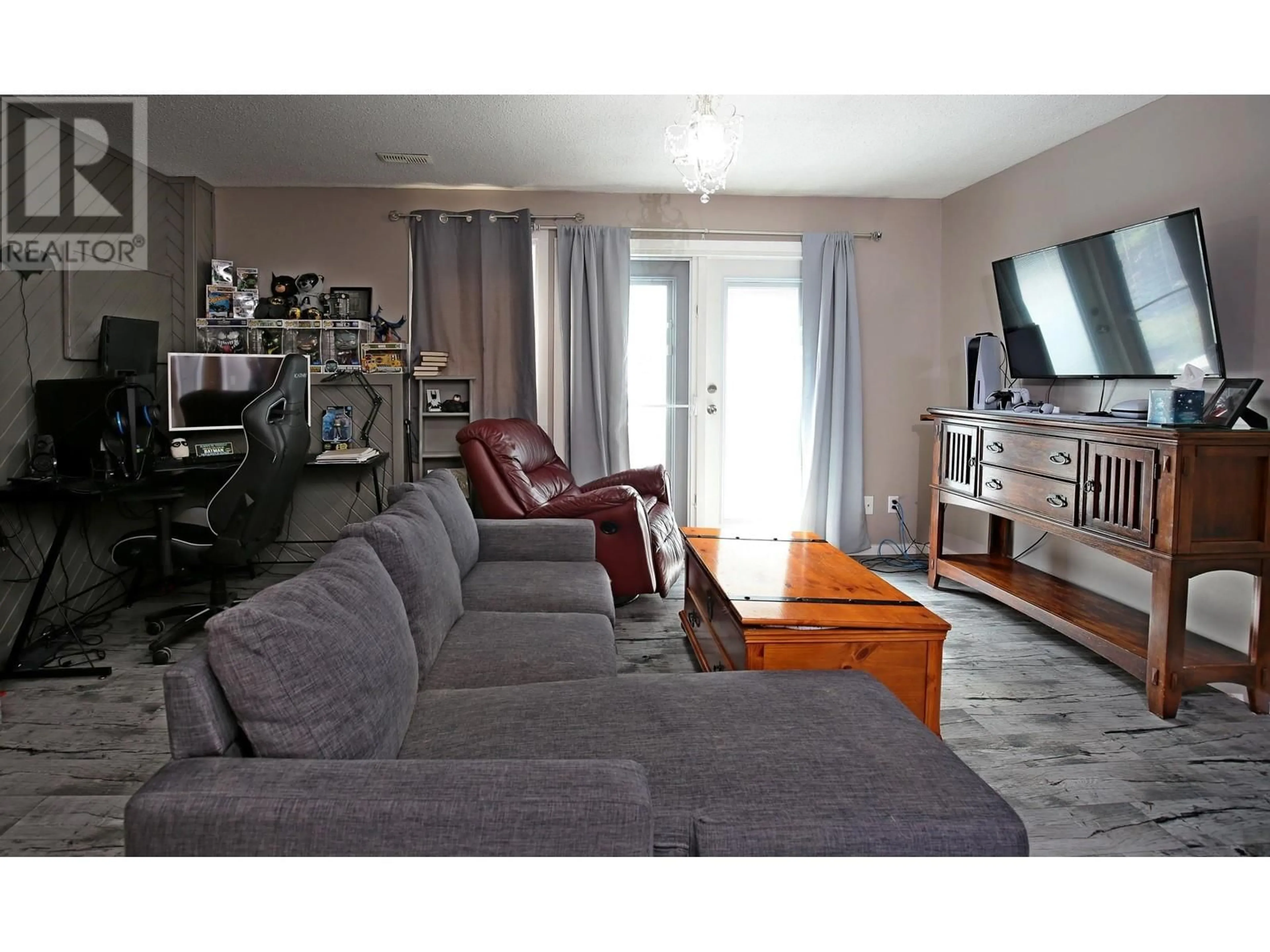 Living room with furniture, wood/laminate floor for 1275 RESKER PLACE, Williams Lake British Columbia V2G4H9