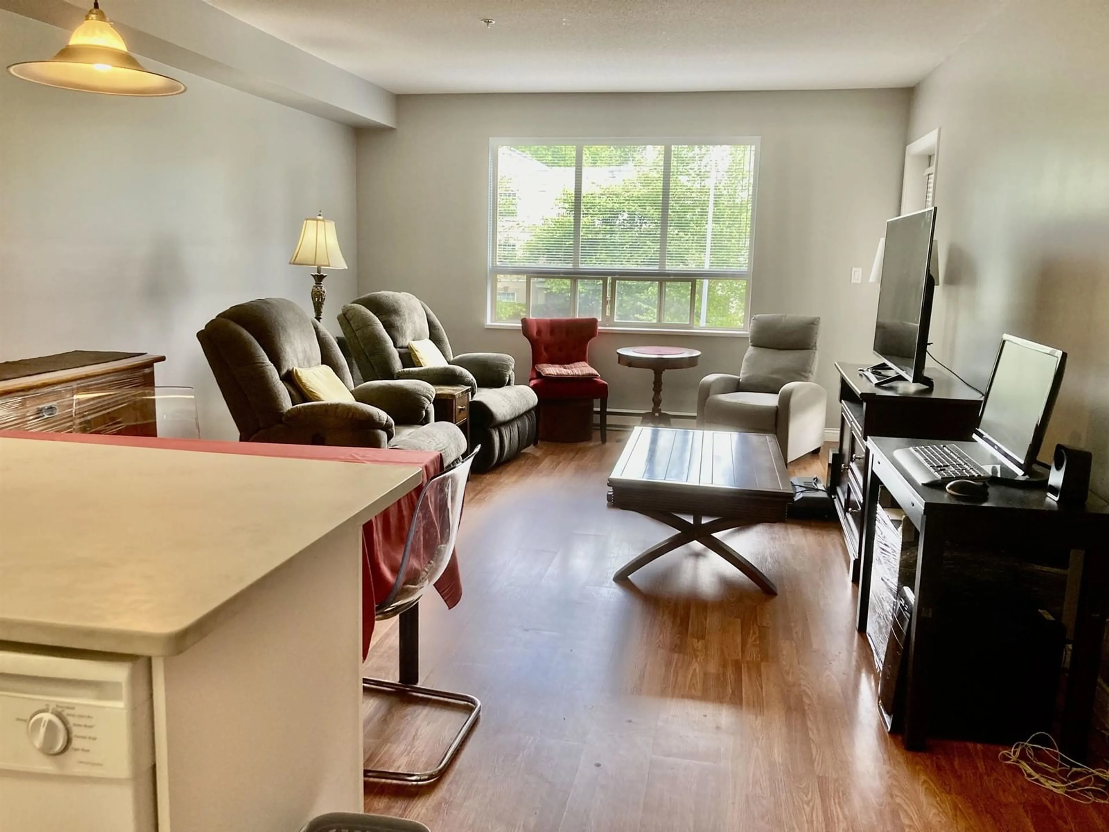 Living room with furniture, wood/laminate floor for 209 - 16068 83, Surrey British Columbia V4N0N2