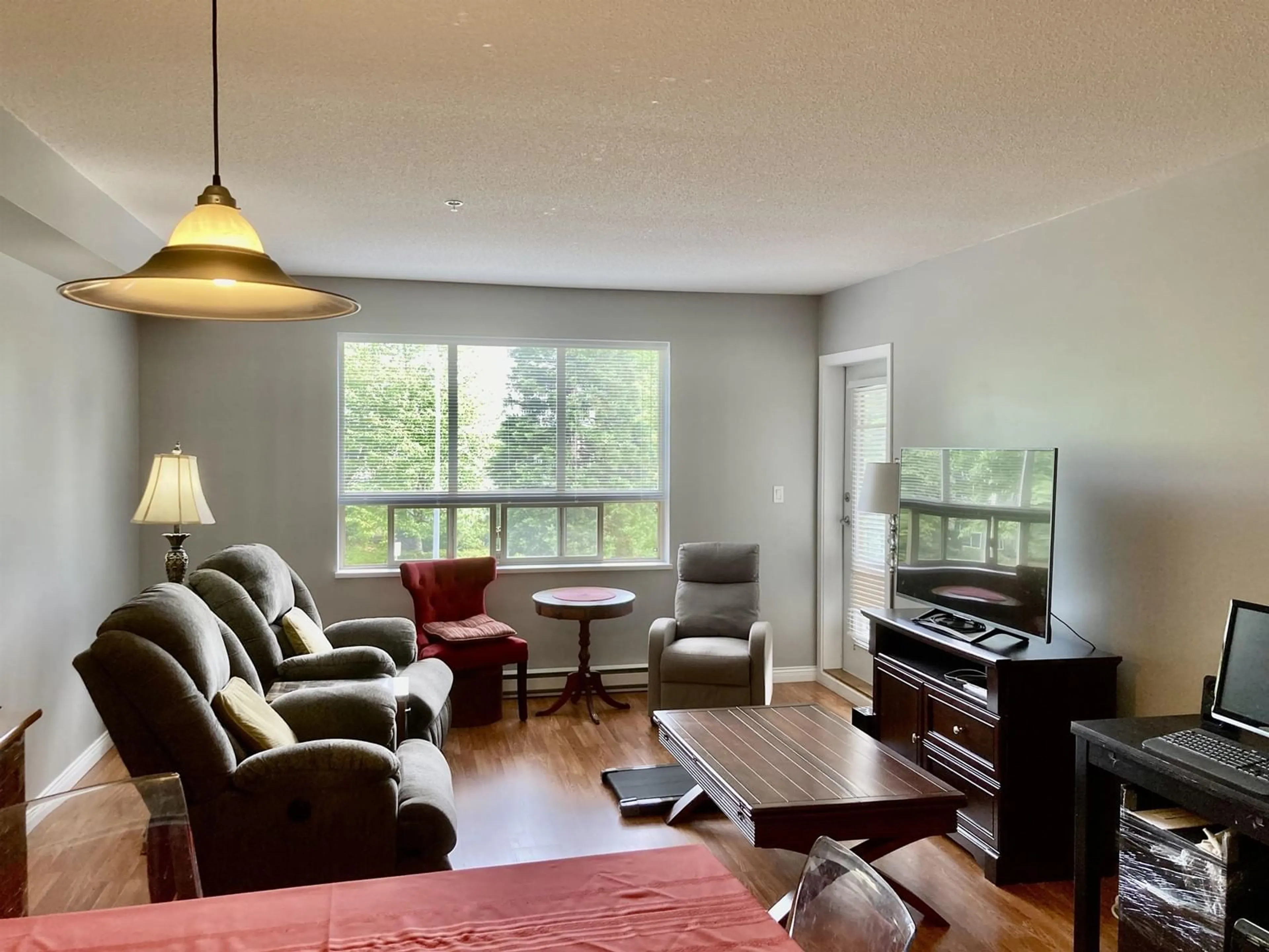 Living room with furniture, wood/laminate floor for 209 - 16068 83, Surrey British Columbia V4N0N2