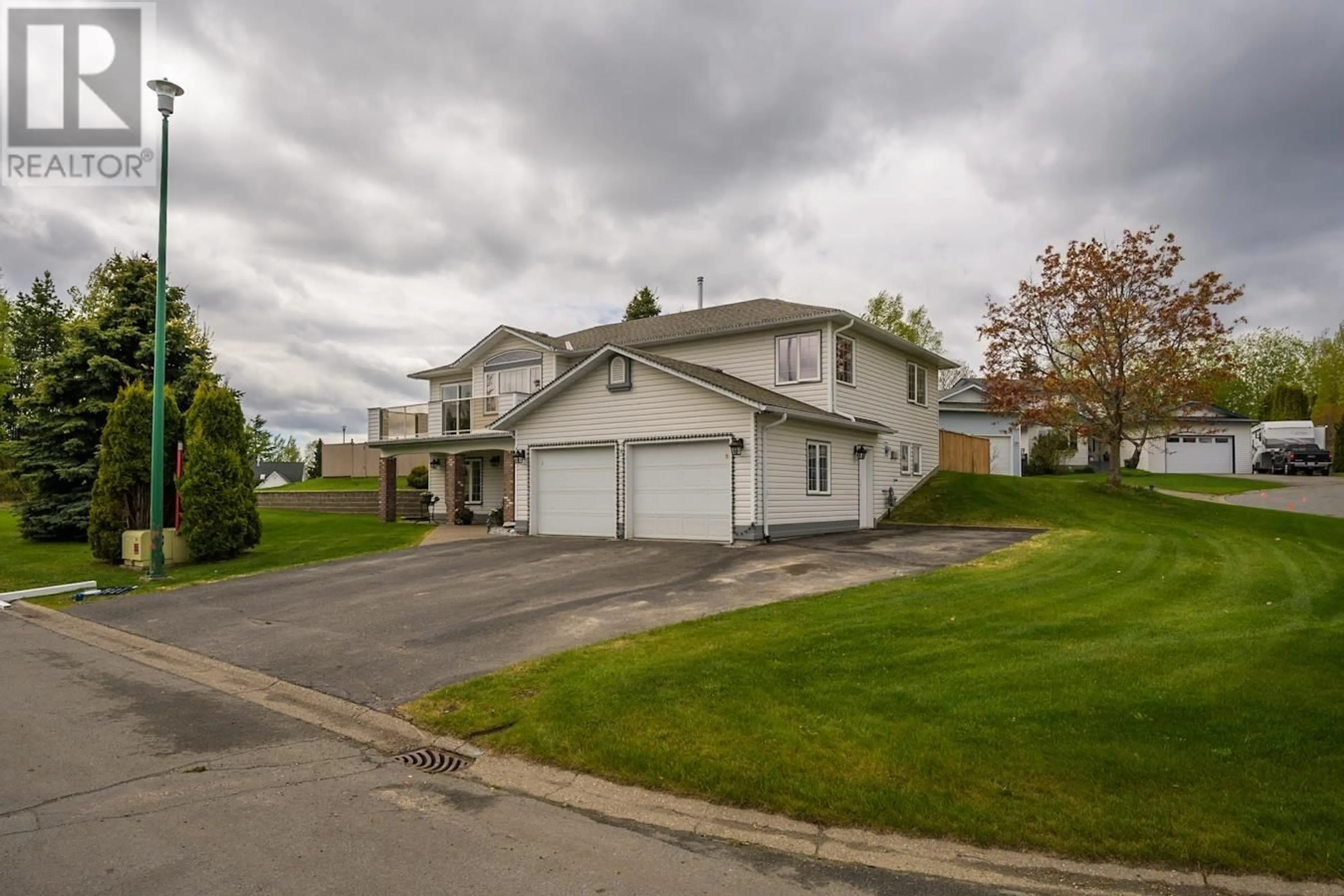 A pic from outside/outdoor area/front of a property/back of a property/a pic from drone, street for 6037 TEICHMAN CRESCENT, Prince George British Columbia V2K4W9