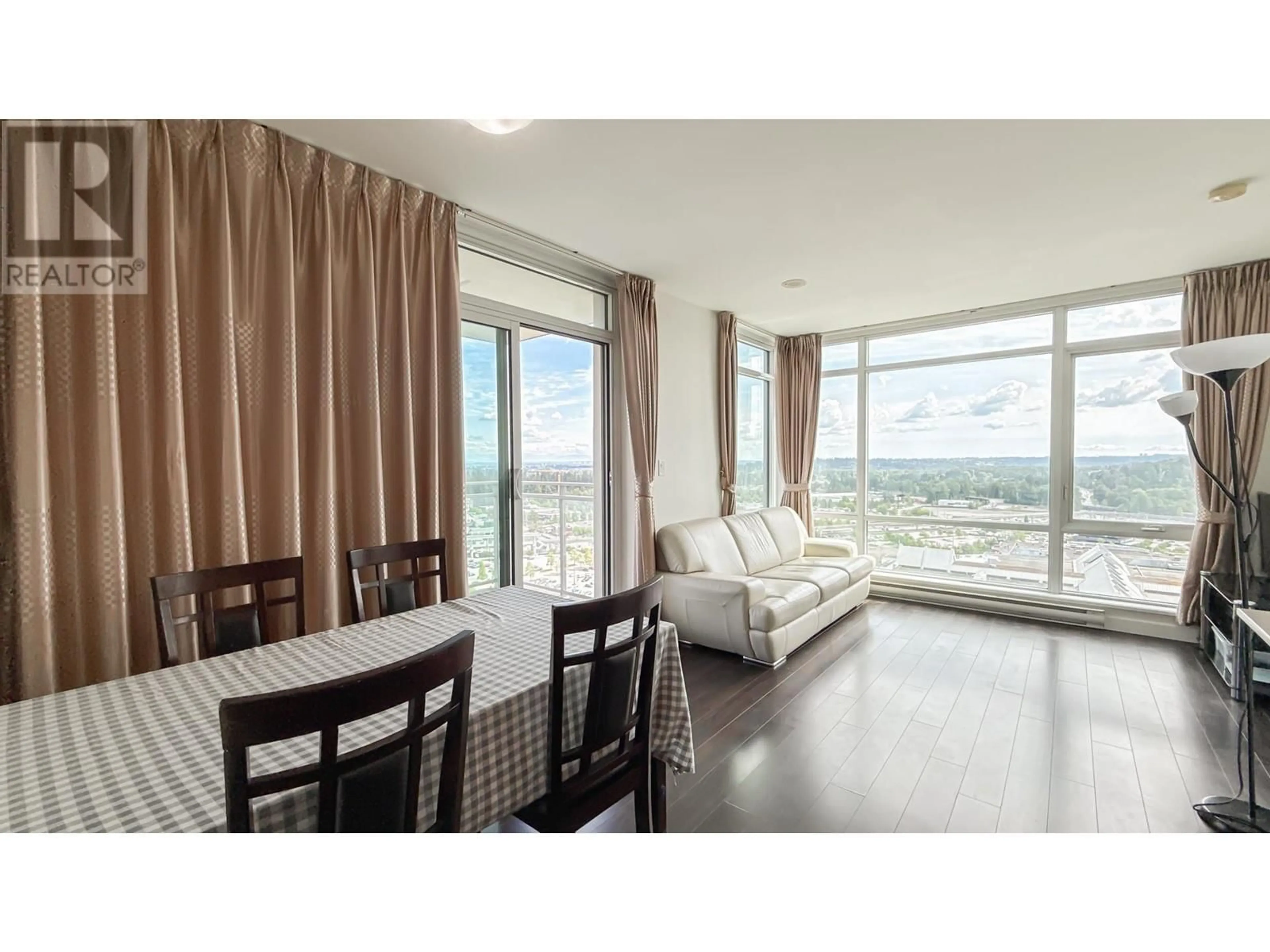 Living room with furniture, wood/laminate floor for 2605 - 2955 ATLANTIC AVENUE, Coquitlam British Columbia V3B0H9