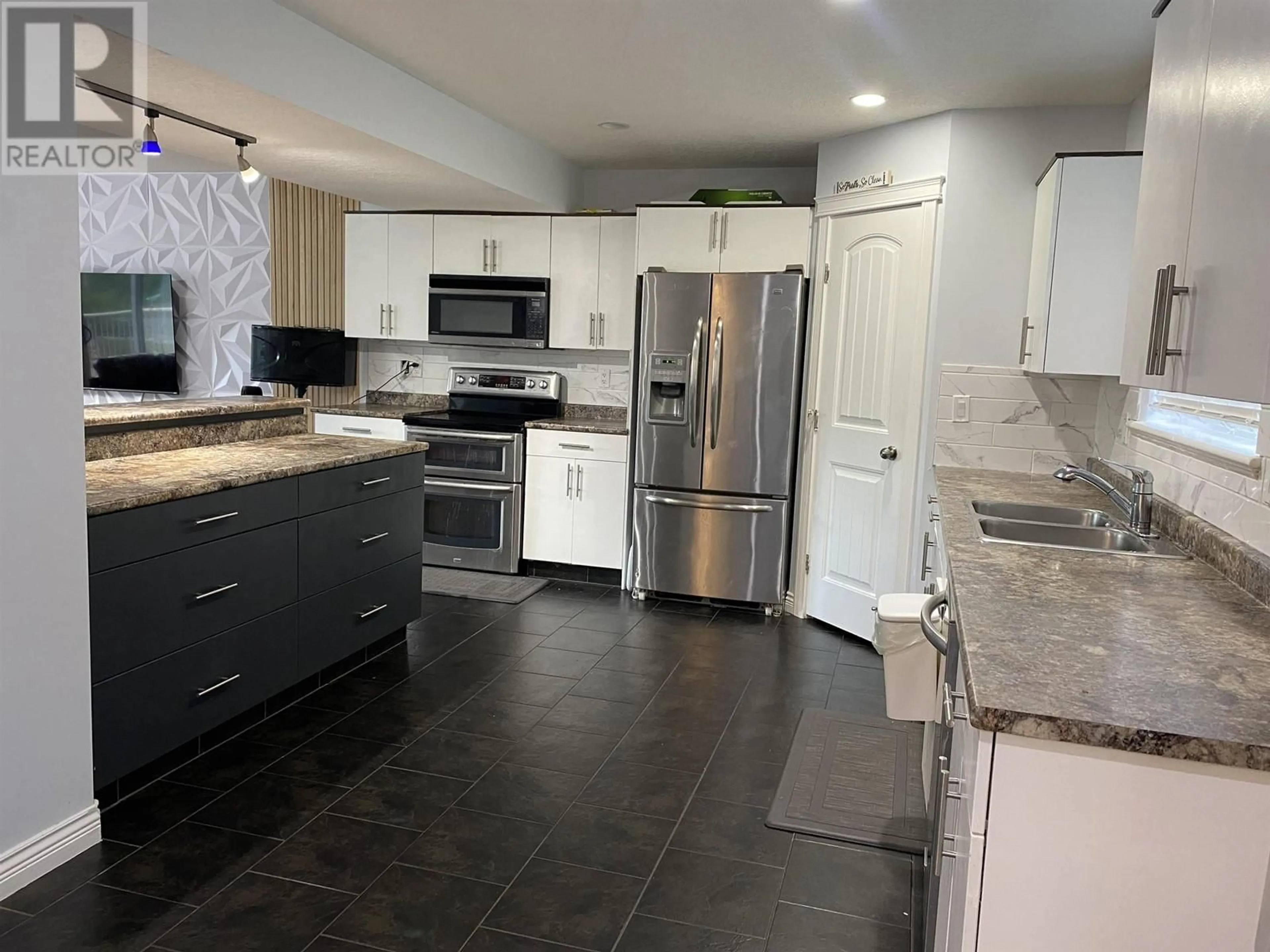 Open concept kitchen, ceramic/tile floor for 7415 CREEKSIDE WAY, Prince George British Columbia V2N0C2