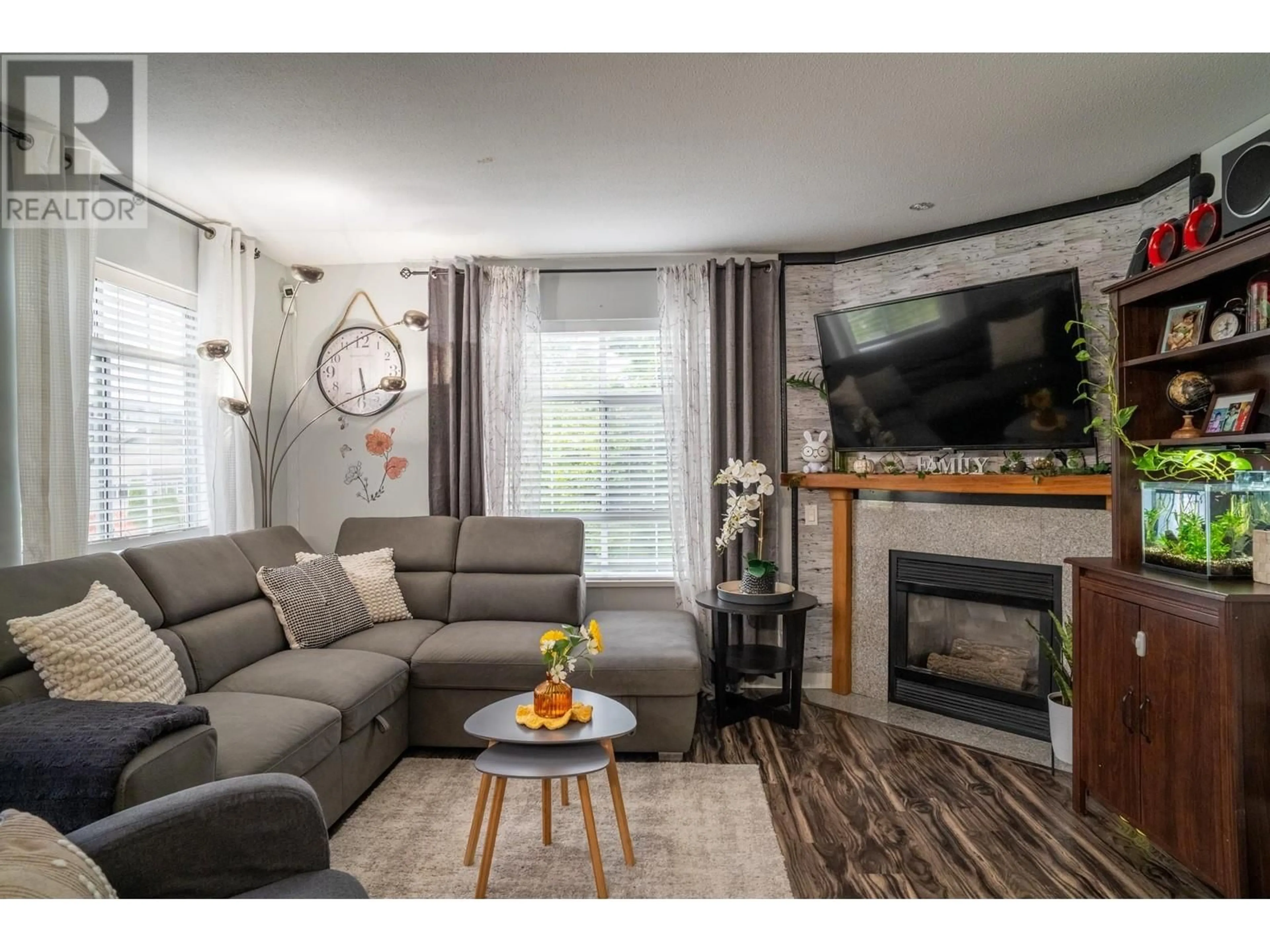 Living room with furniture, wood/laminate floor for 303 - 1990 COQUITLAM AVENUE, Port Coquitlam British Columbia V3B7R2