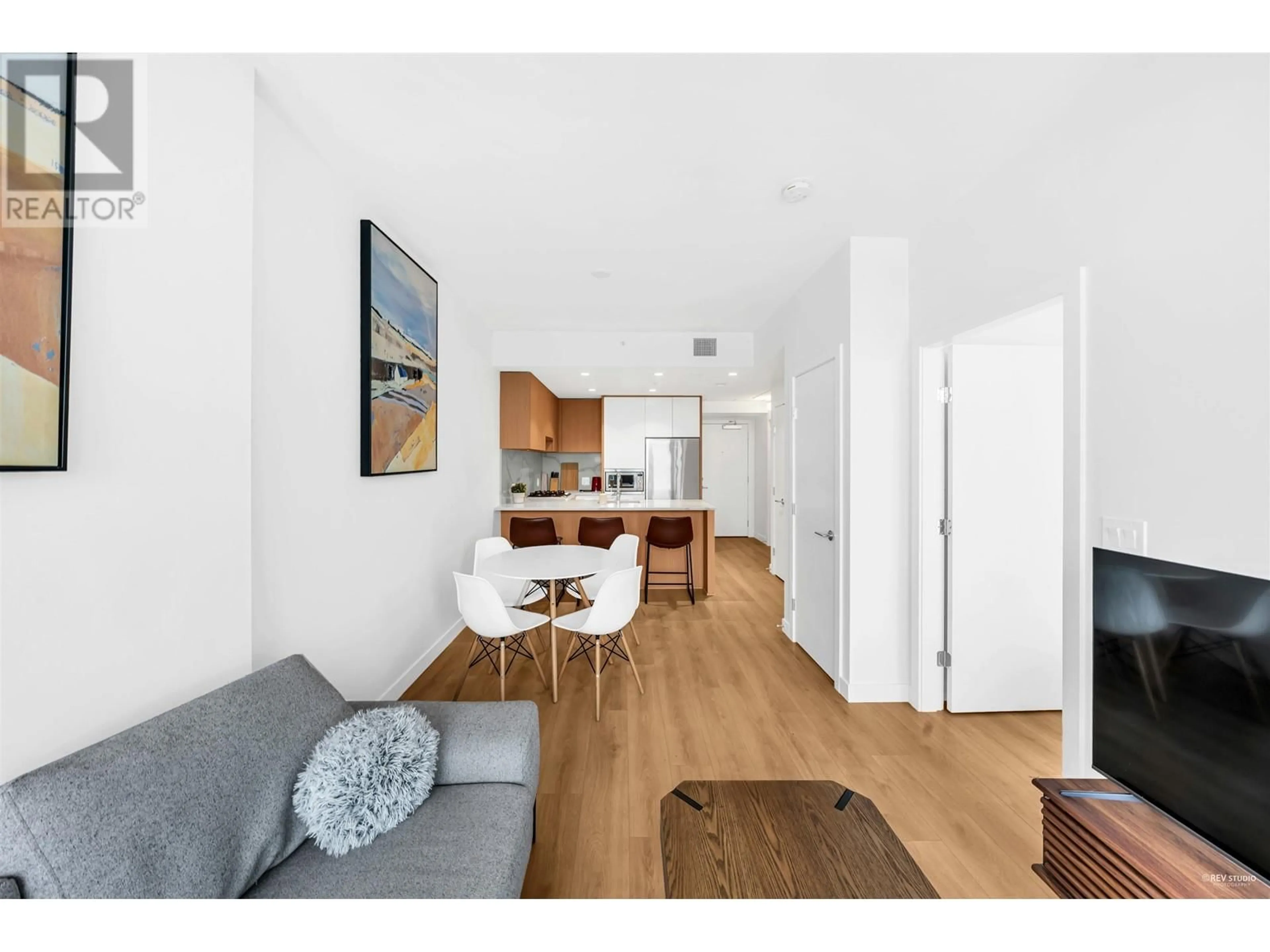 Open concept kitchen, wood/laminate floor for 2105 - 567 CLARKE ROAD, Coquitlam British Columbia V3J0K7