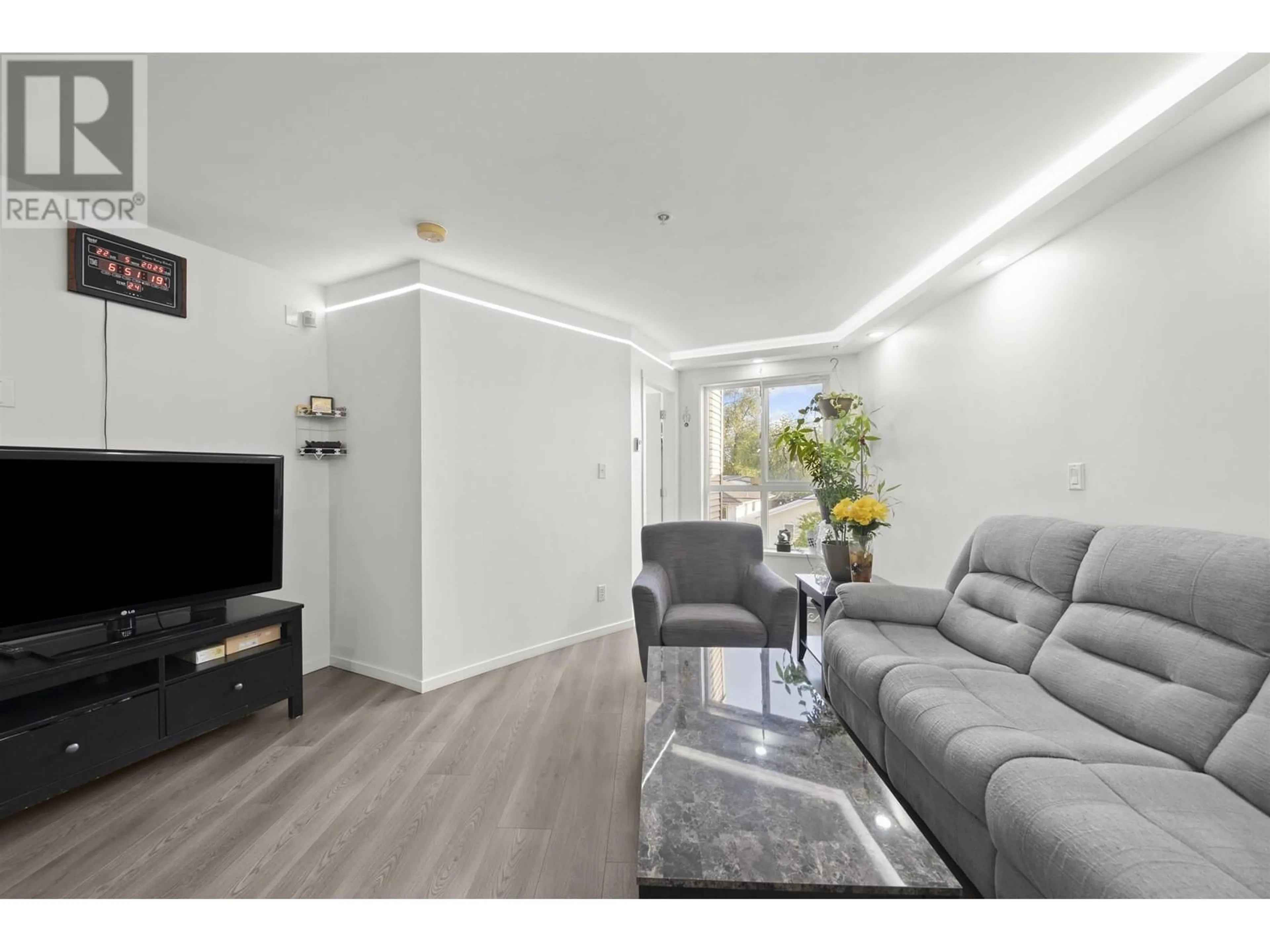 Living room with furniture, unknown for 307 - 5438 RUPERT STREET, Vancouver British Columbia V5R2K3