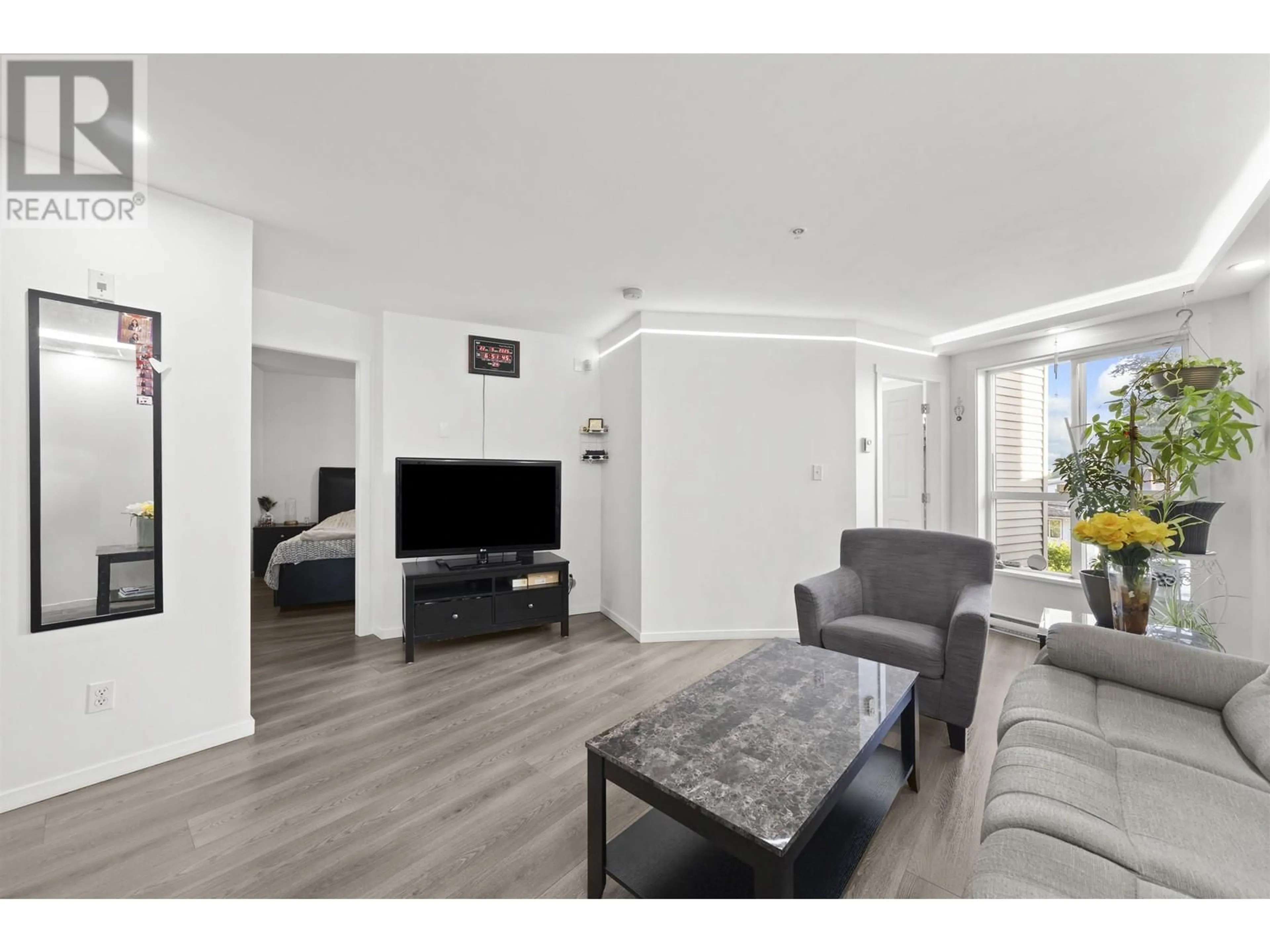 Living room with furniture, unknown for 307 - 5438 RUPERT STREET, Vancouver British Columbia V5R2K3