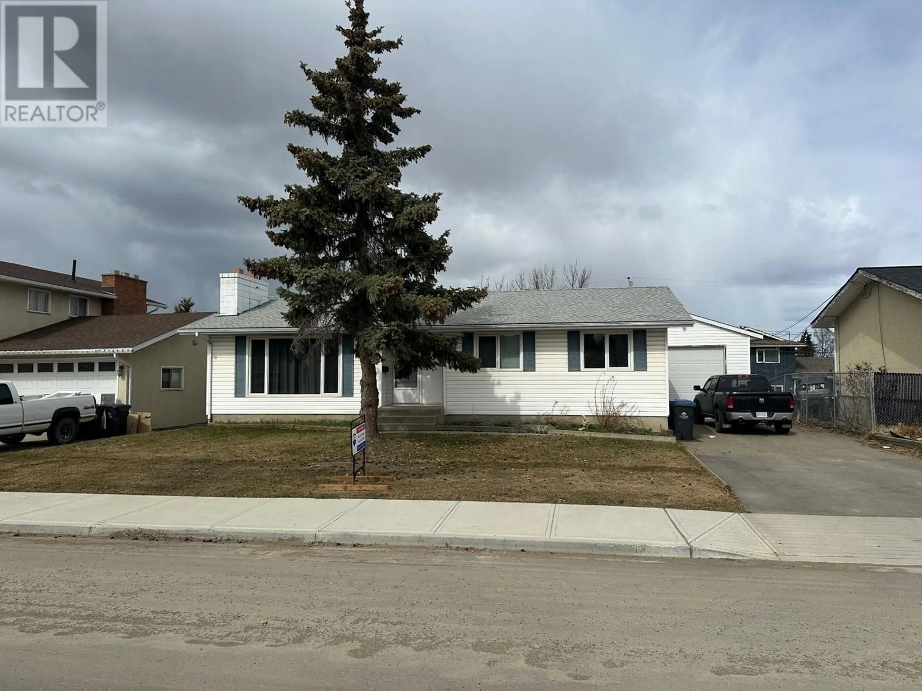 Home with vinyl exterior material, street for 10412 112 AVENUE, Fort St. John British Columbia V1J2W7