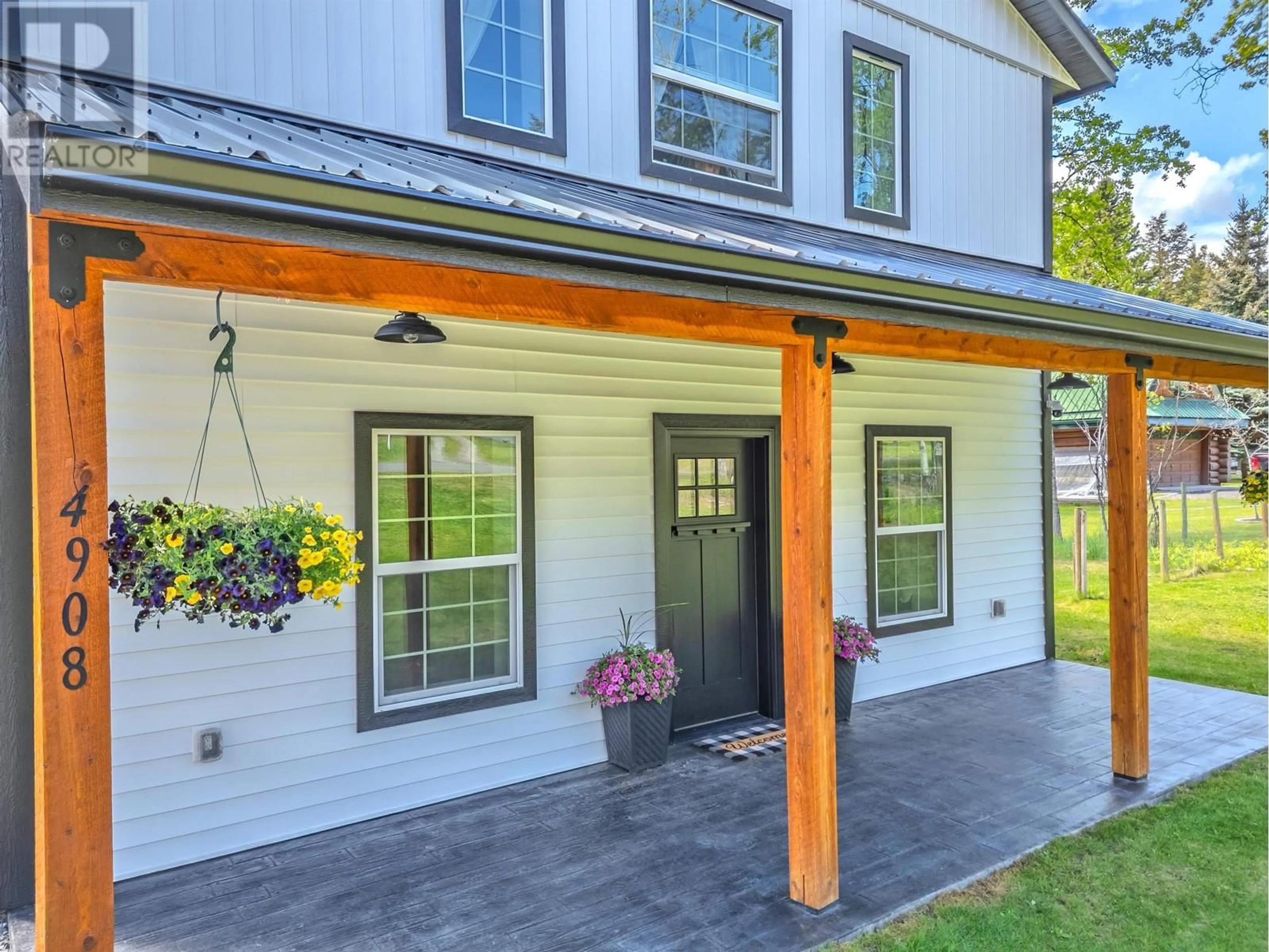 Home with vinyl exterior material, street for 4908 KITWANGA DRIVE, 108 Mile Ranch British Columbia V0K2Z0