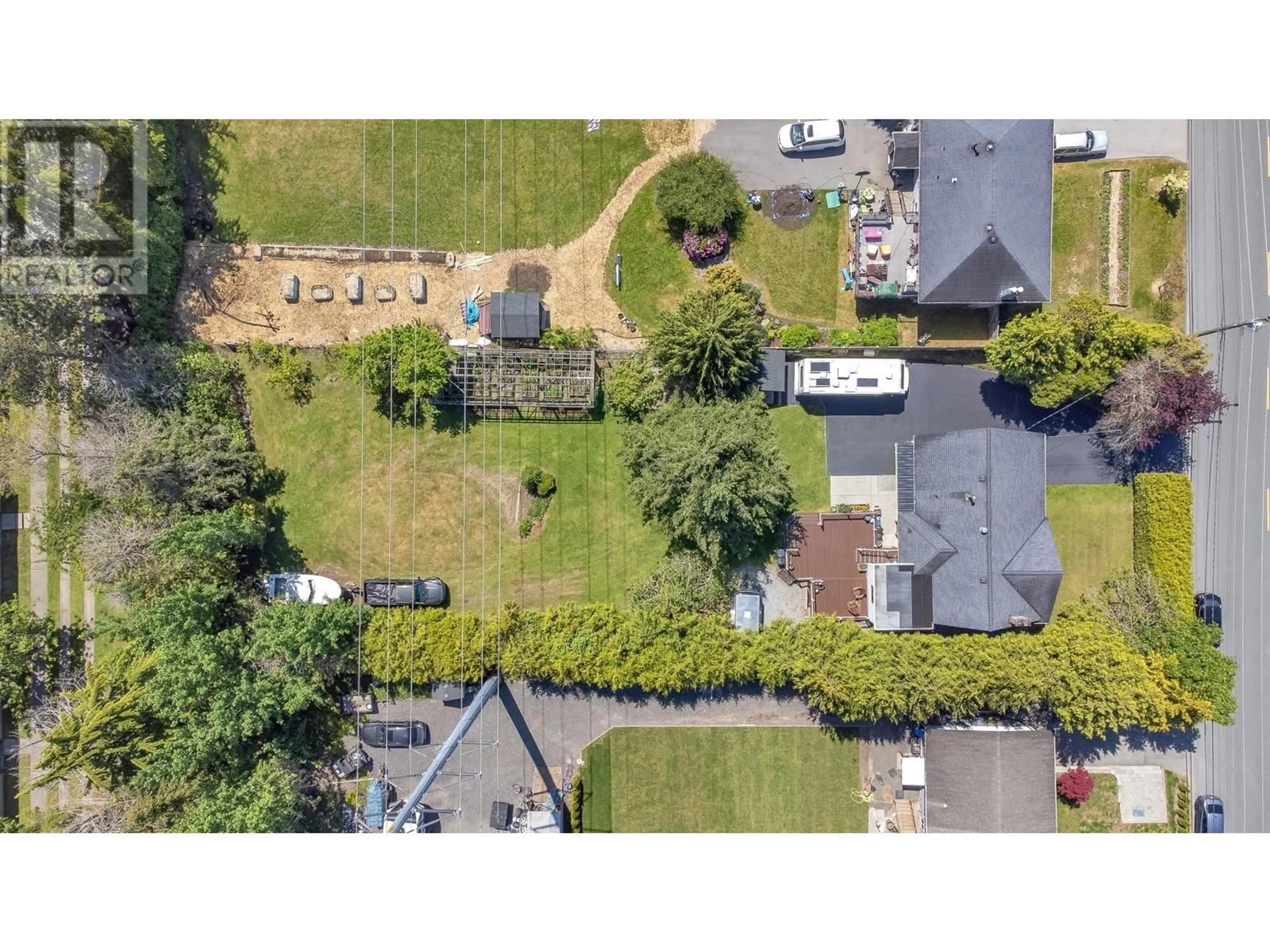 A pic from outside/outdoor area/front of a property/back of a property/a pic from drone, street for 1110 53A STREET, Delta British Columbia V4M3E3