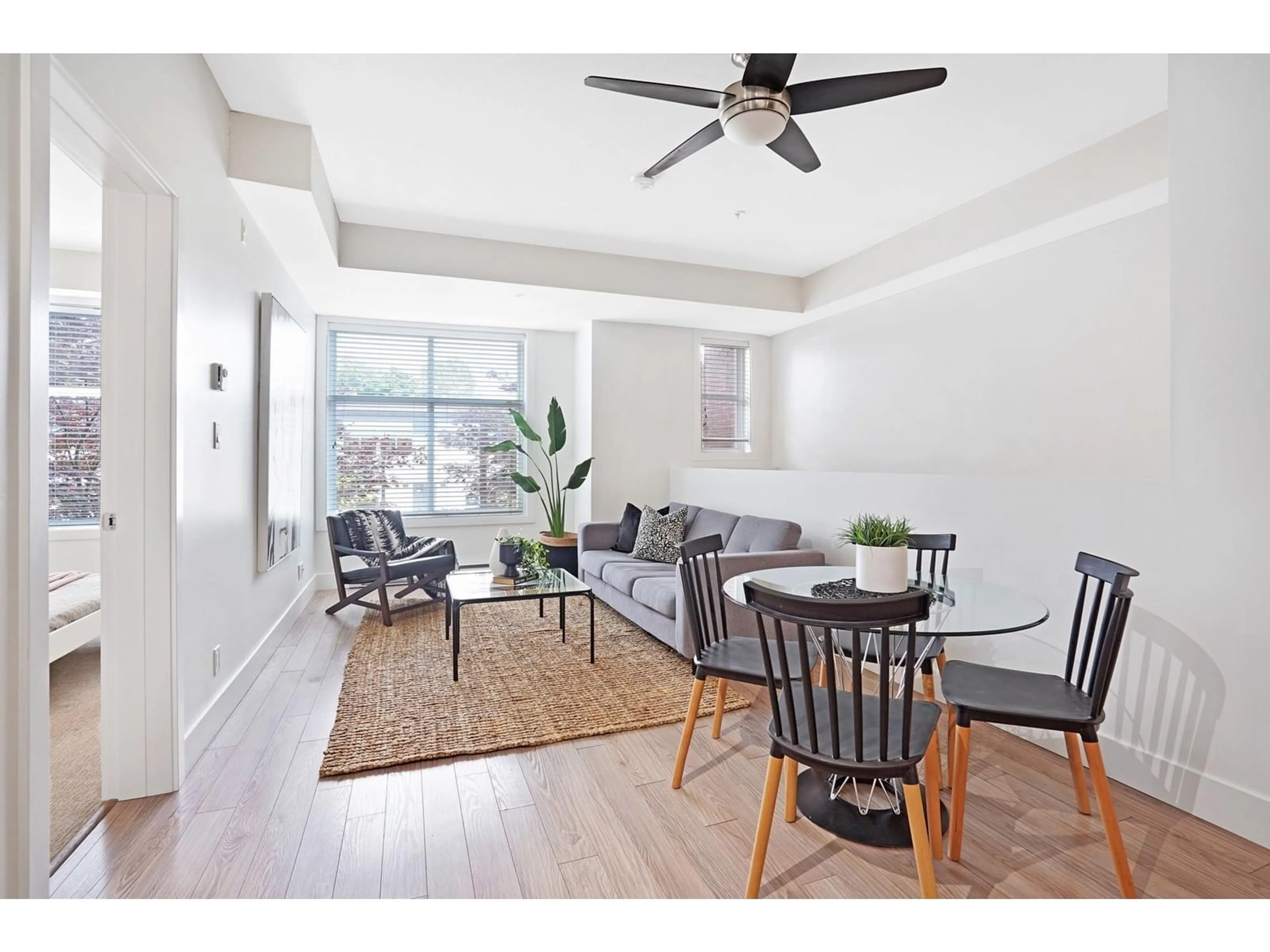 Living room with furniture, wood/laminate floor for 101 - 15956 86A, Surrey British Columbia V4N6N8