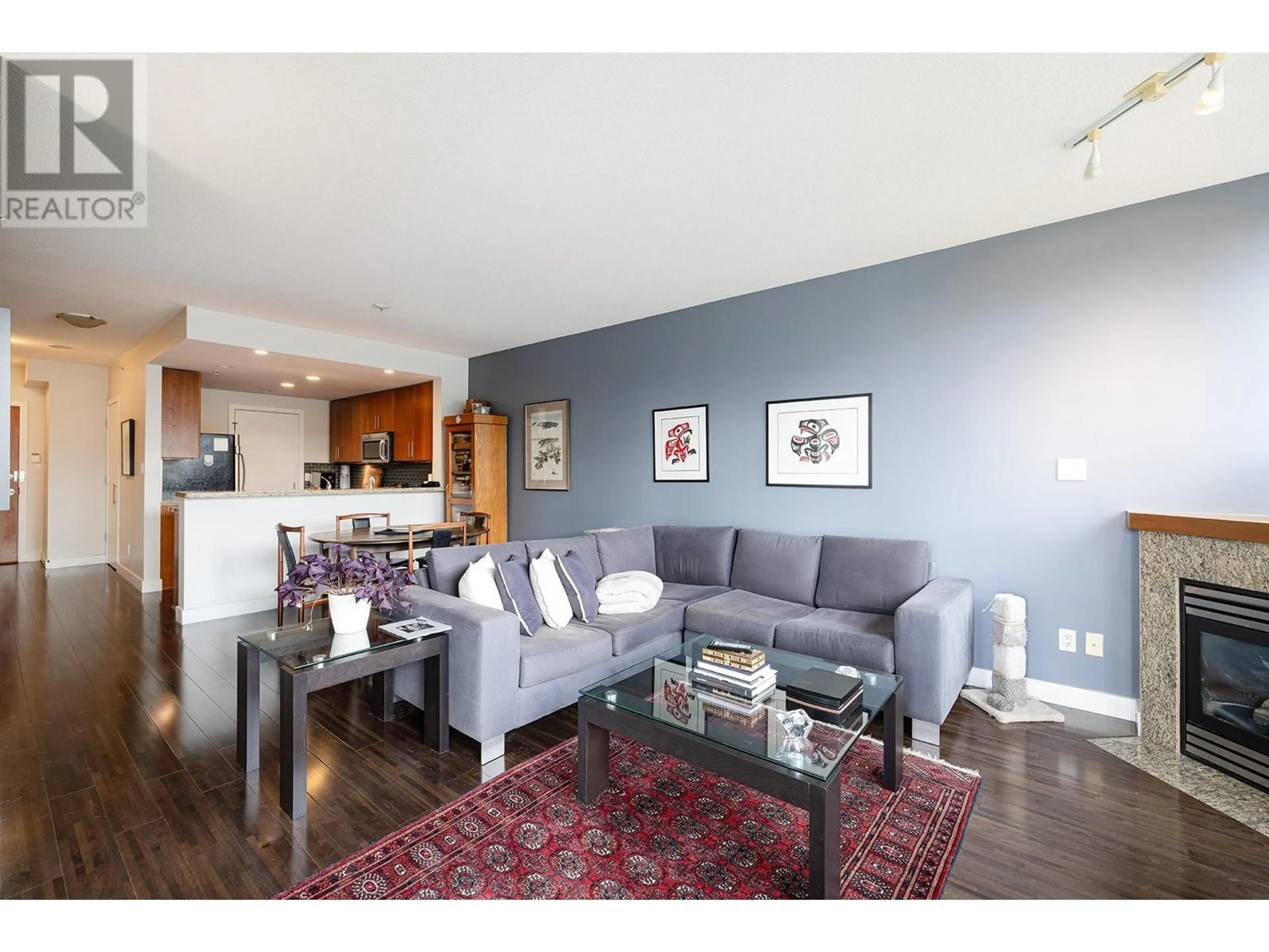 Living room with furniture, wood/laminate floor for 301 - 1483 7TH AVENUE, Vancouver British Columbia V6H4H2
