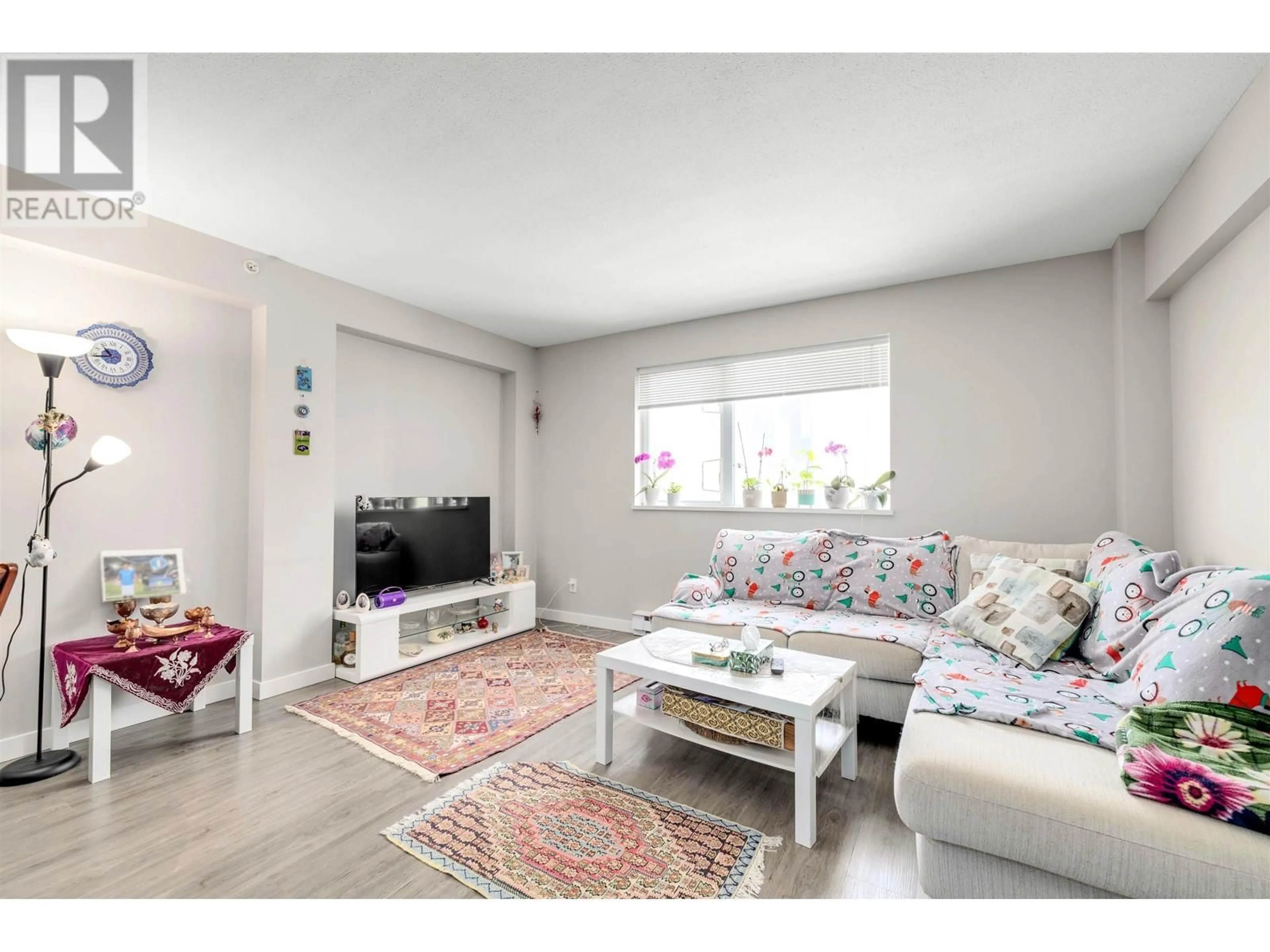 Living room with furniture, unknown for 301 - 200 KEARY STREET, New Westminster British Columbia V3L0A6
