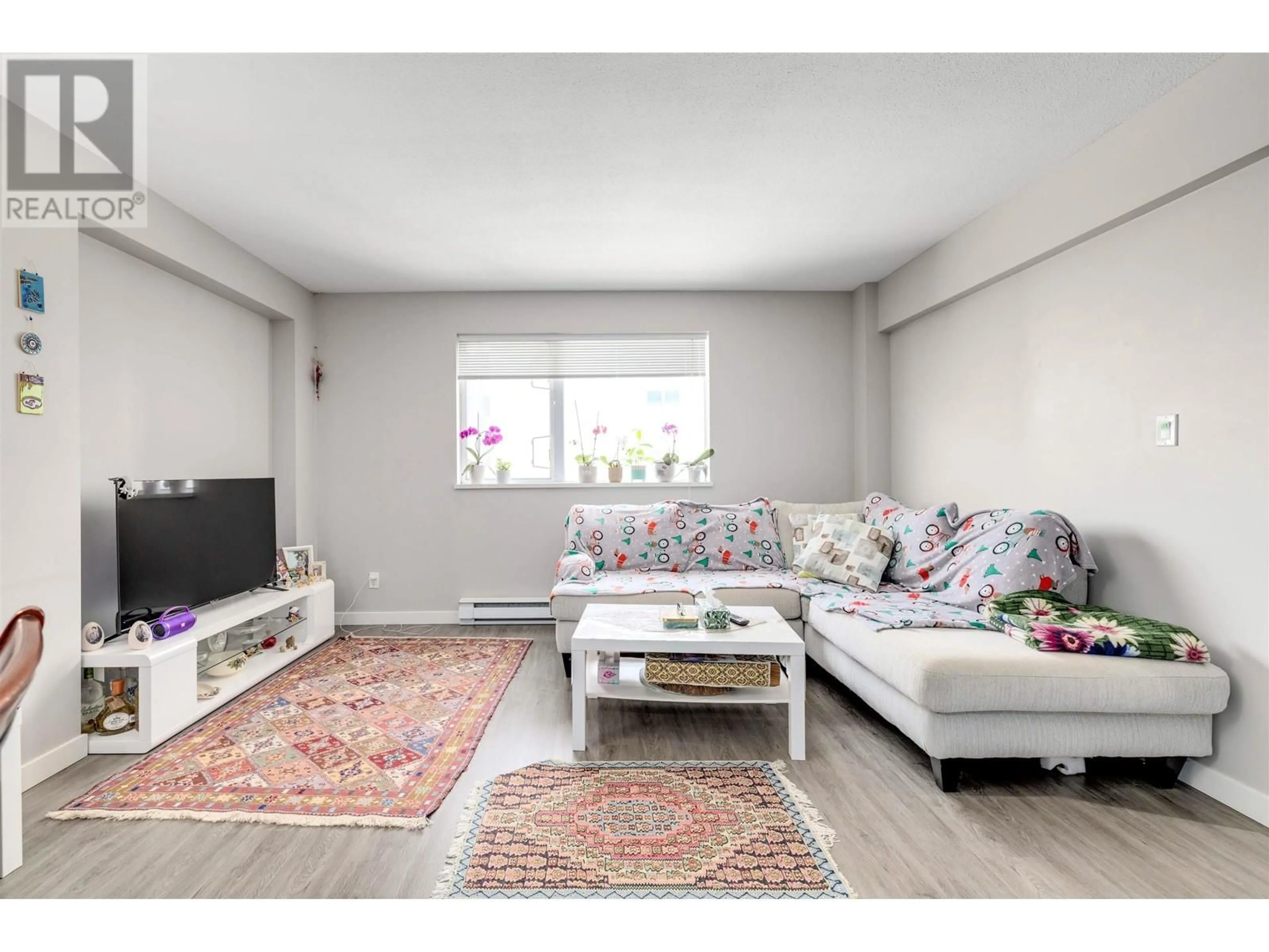 Living room with furniture, unknown for 301 - 200 KEARY STREET, New Westminster British Columbia V3L0A6