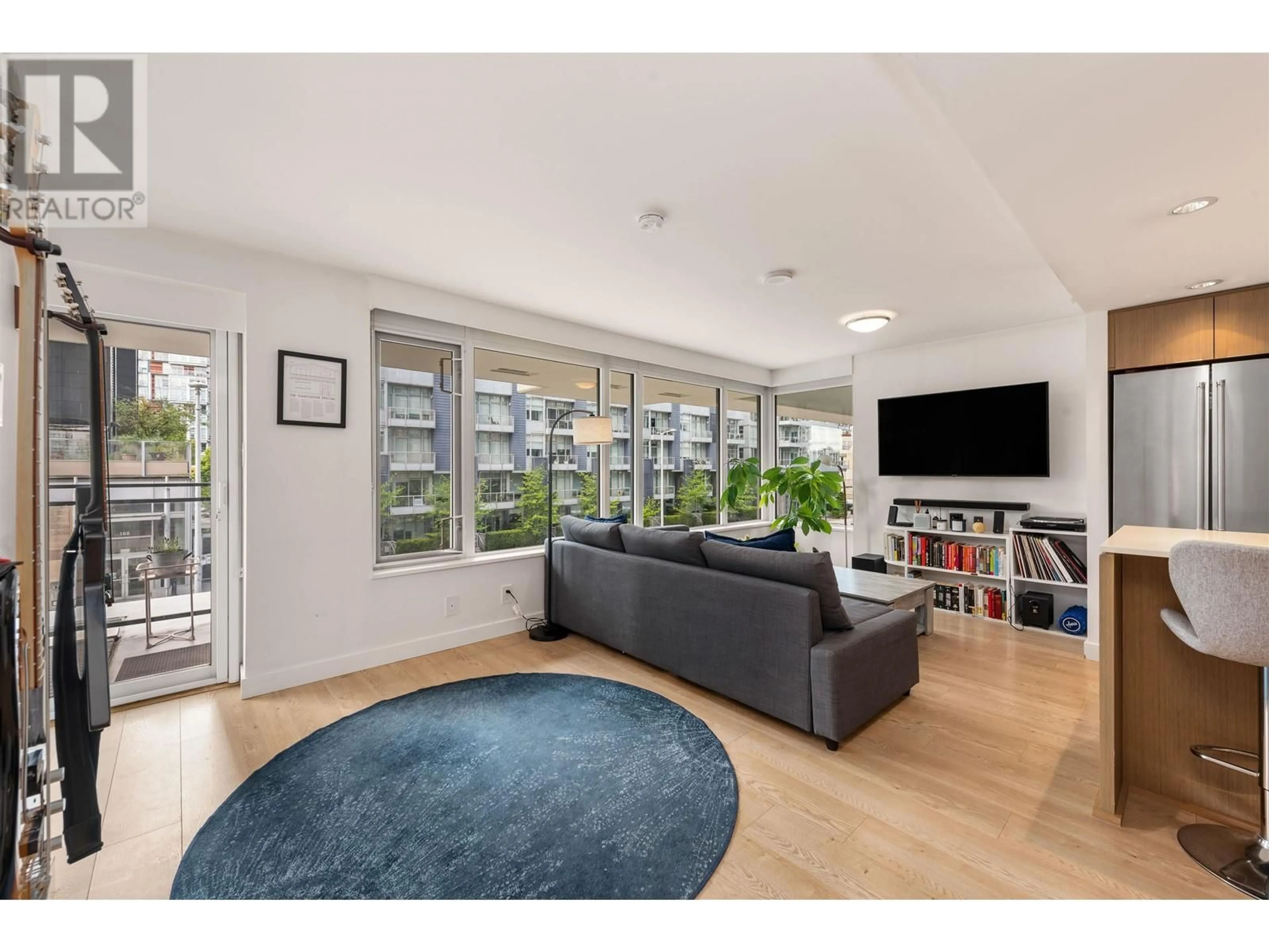 Living room with furniture, wood/laminate floor for 208 - 161 1ST AVENUE, Vancouver British Columbia V6A0G1