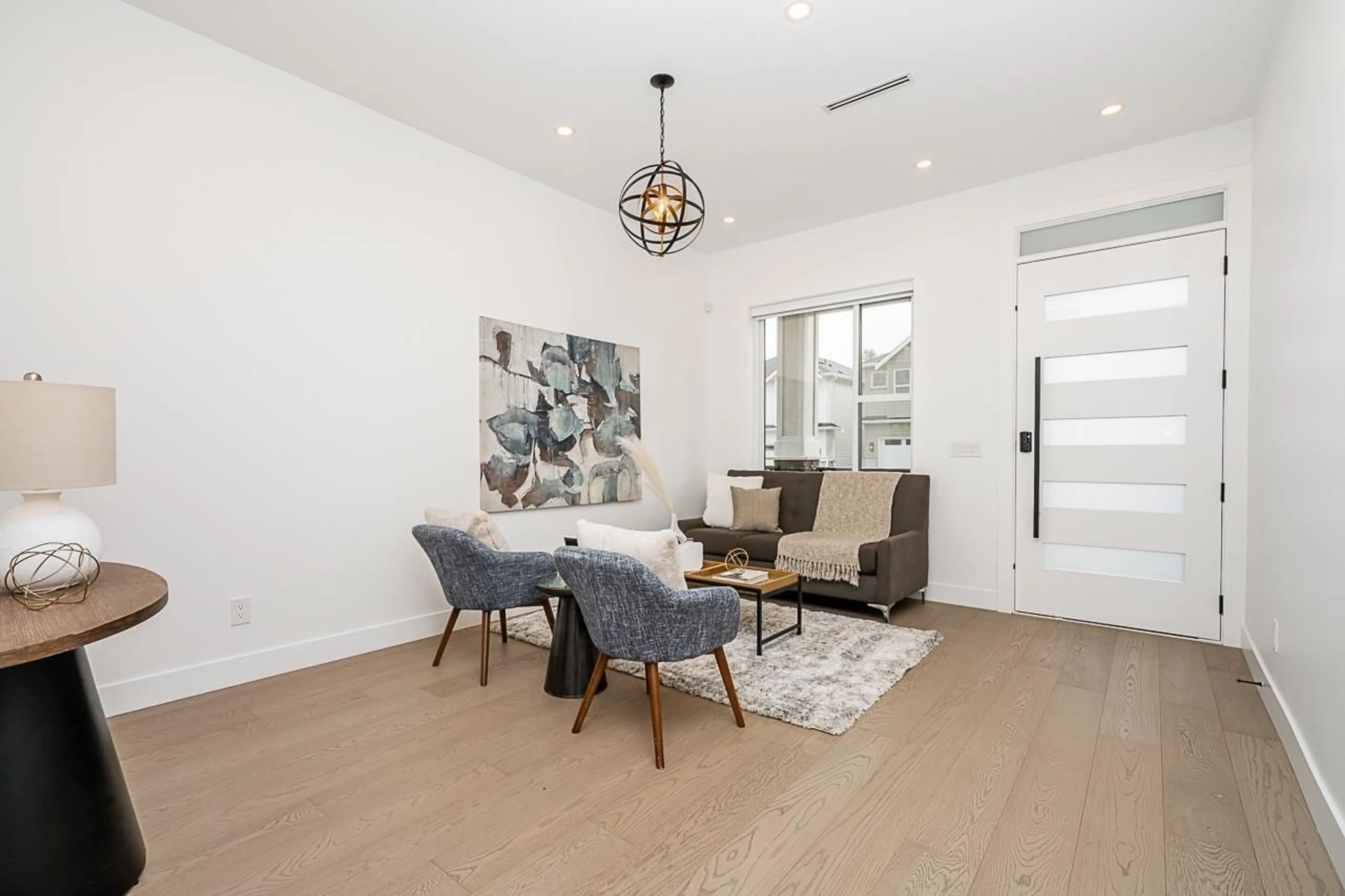 Living room with furniture, wood/laminate floor for 7511 205, Langley British Columbia V2Y3S8