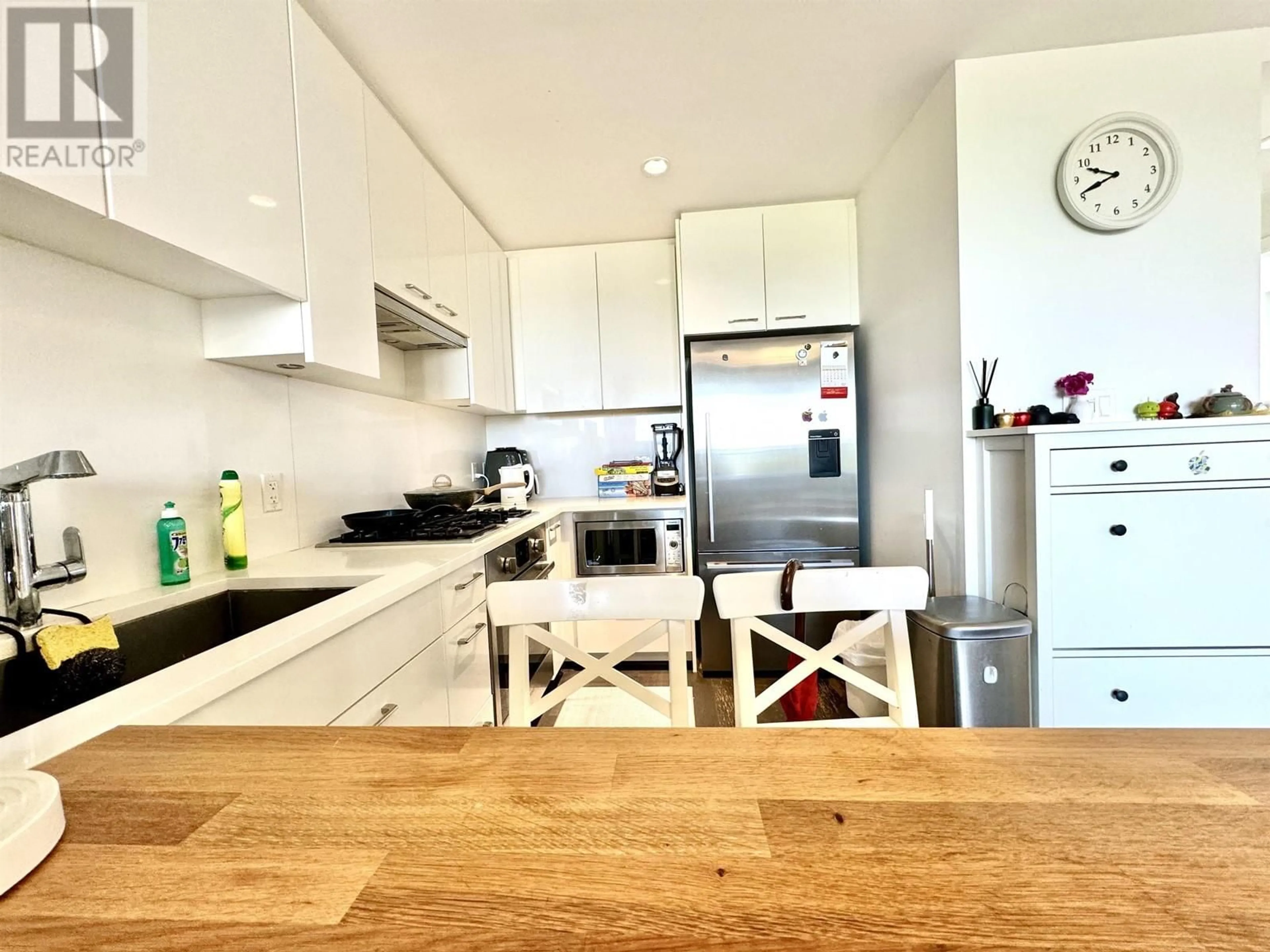 Contemporary kitchen, wood/laminate floor for 703 - 6383 CAMBIE STREET, Vancouver British Columbia V5Z0G7