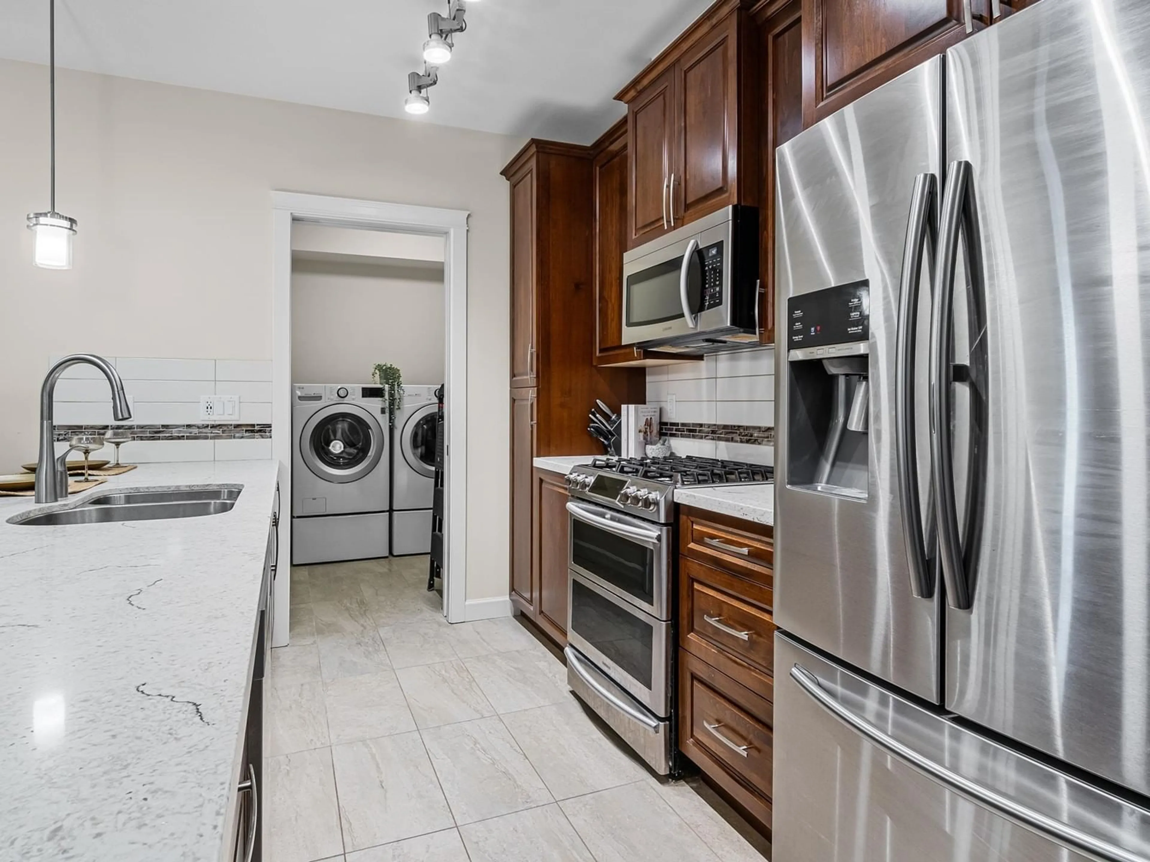 Kitchen with laundary machines, ceramic/tile floor for A113 - 20716 WILLOUGHBY TOWN CENTRE, Langley British Columbia V2Y3J7