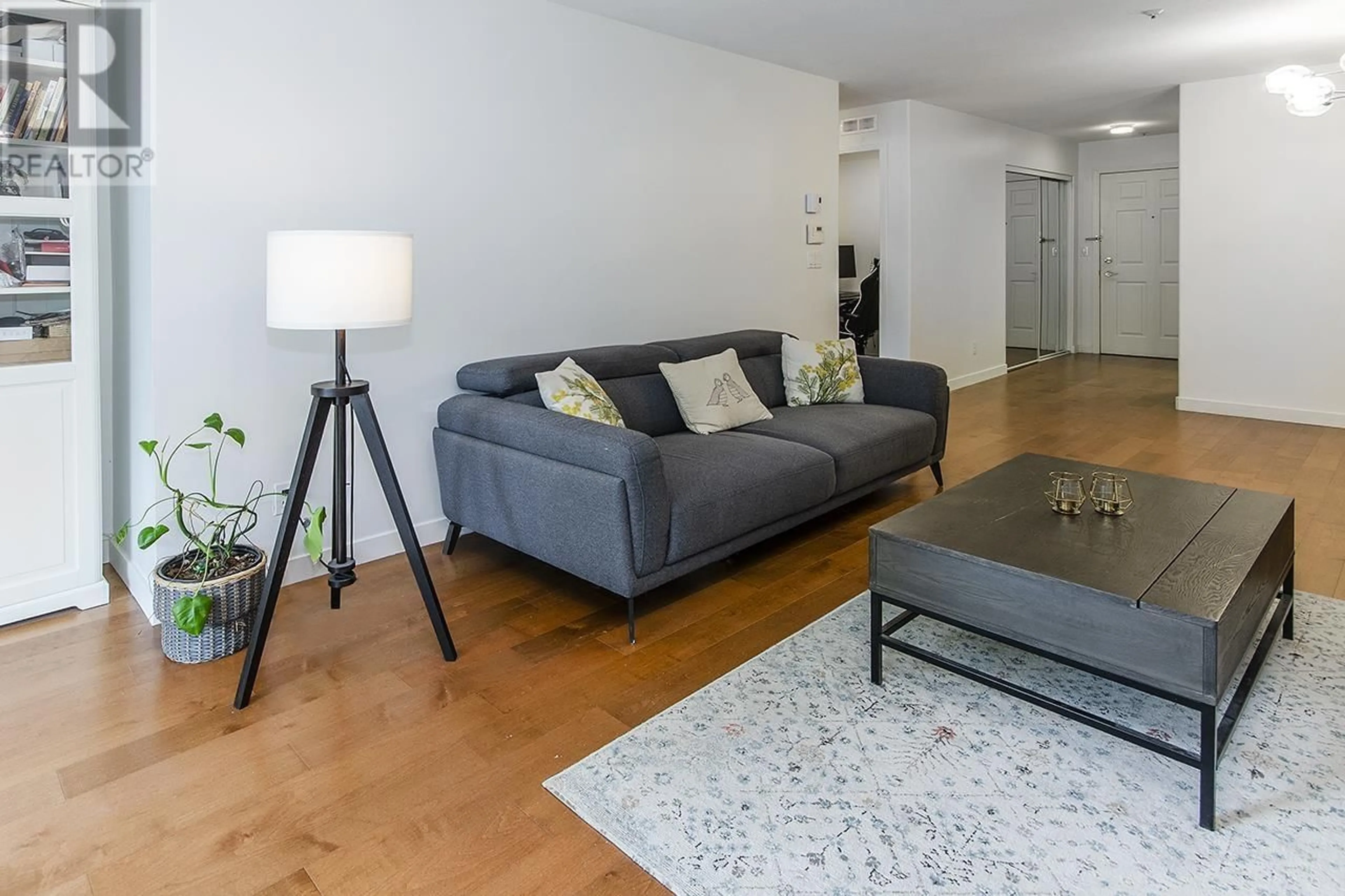 Living room with furniture, wood/laminate floor for 210 - 5788 VINE STREET, Vancouver British Columbia V6M4L8