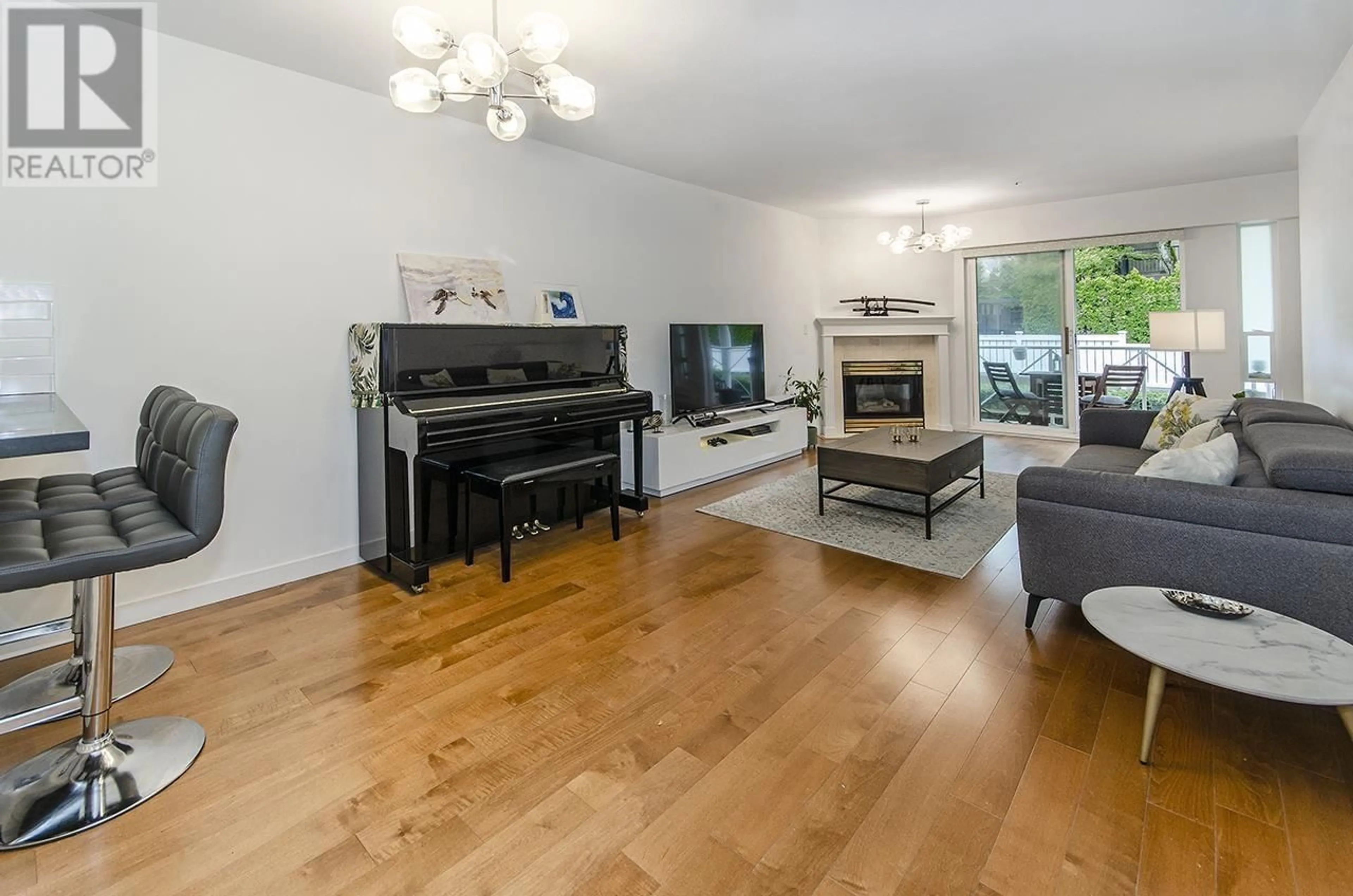 Living room with furniture, wood/laminate floor for 210 - 5788 VINE STREET, Vancouver British Columbia V6M4L8