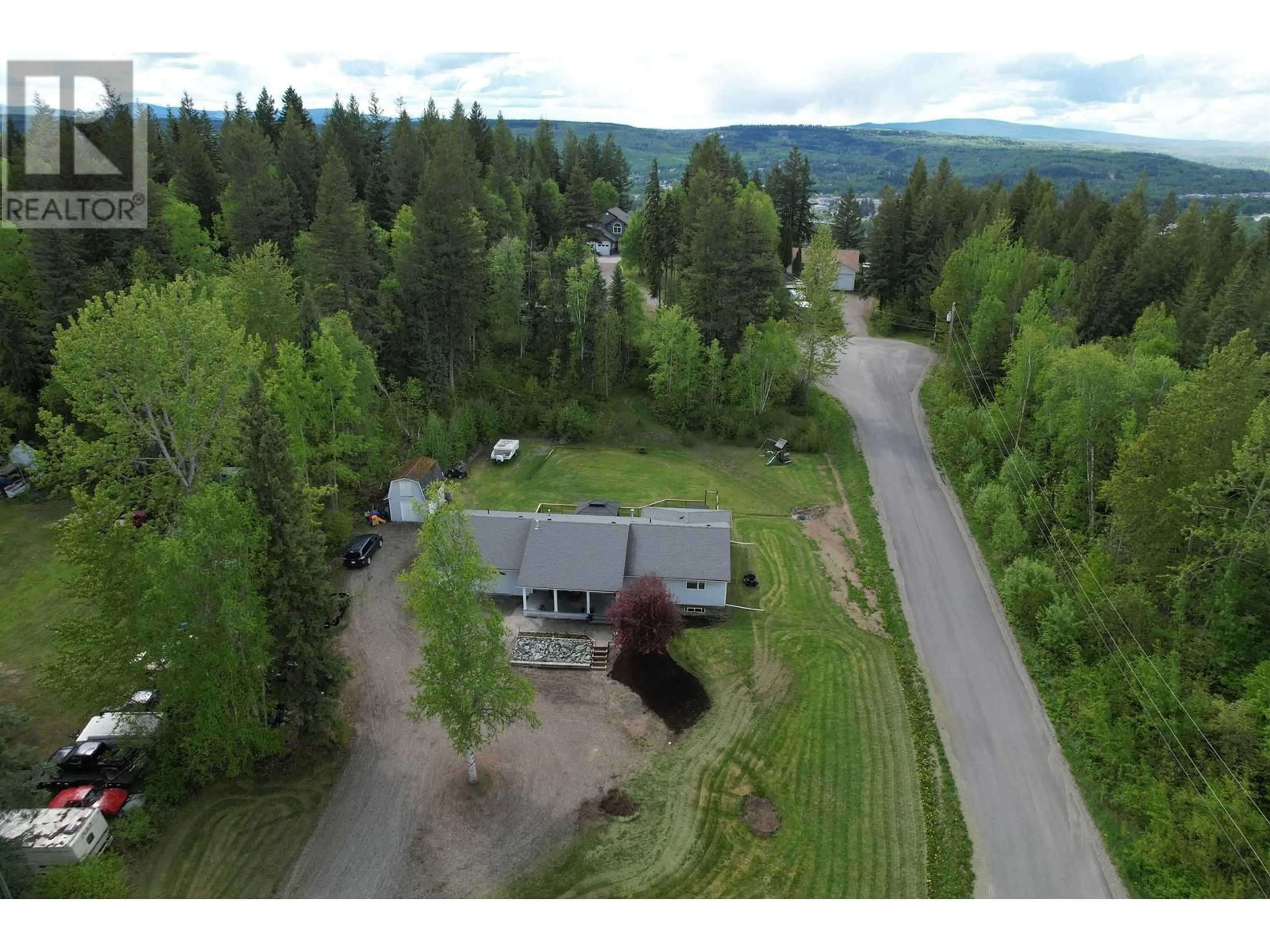 A pic from outside/outdoor area/front of a property/back of a property/a pic from drone, mountain view for 1966 ALDER AVENUE, Quesnel British Columbia V2J3T3