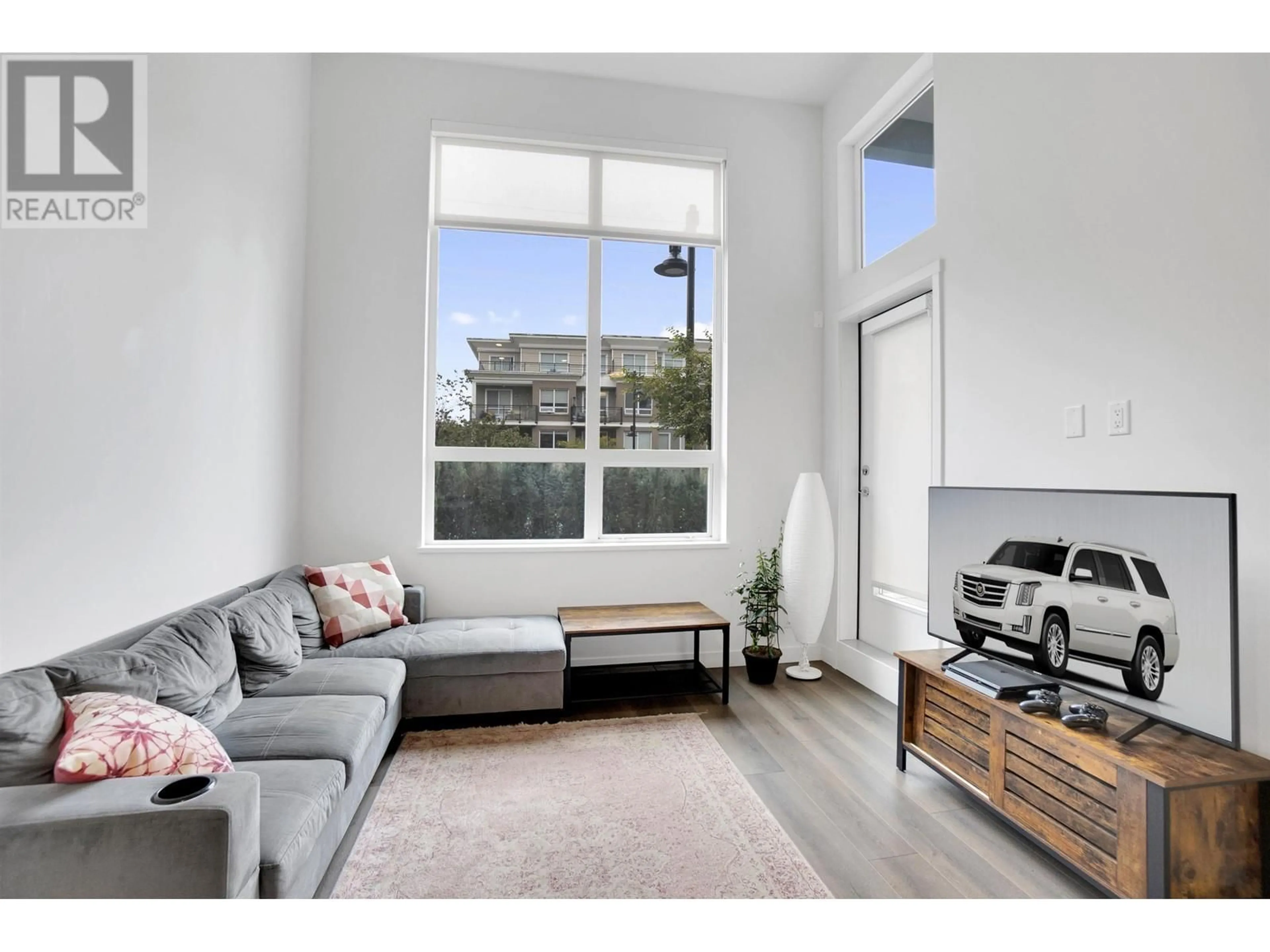 Living room with furniture, unknown for 110 - 645 COMO LAKE AVENUE, Coquitlam British Columbia V3J0N9