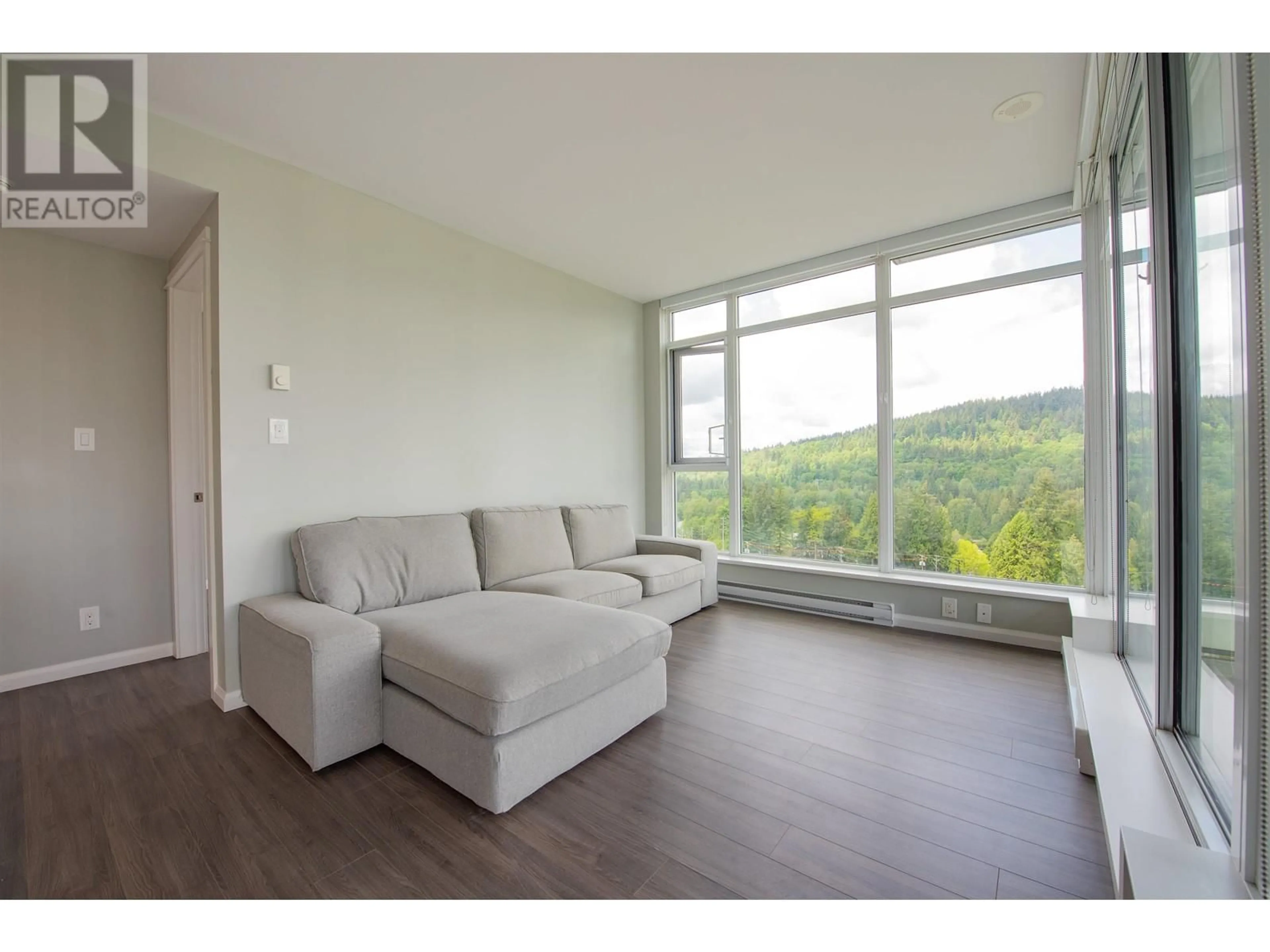 Living room with furniture, wood/laminate floor for 1105 - 520 COMO LAKE AVENUE, Coquitlam British Columbia V3J0E8