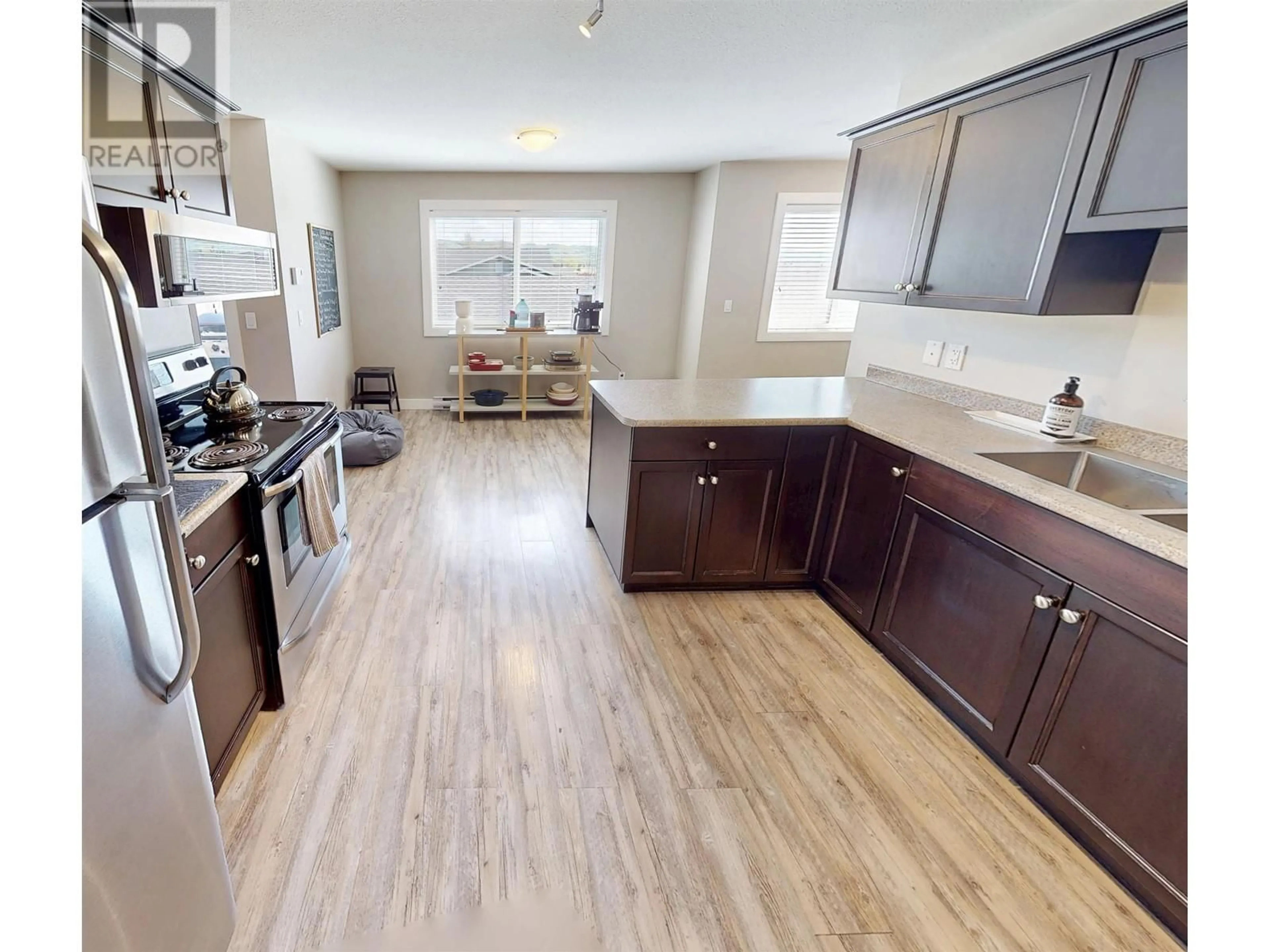 Open concept kitchen, wood/laminate floor for 2 - 9707 99 AVENUE, Taylor British Columbia V0C2K0
