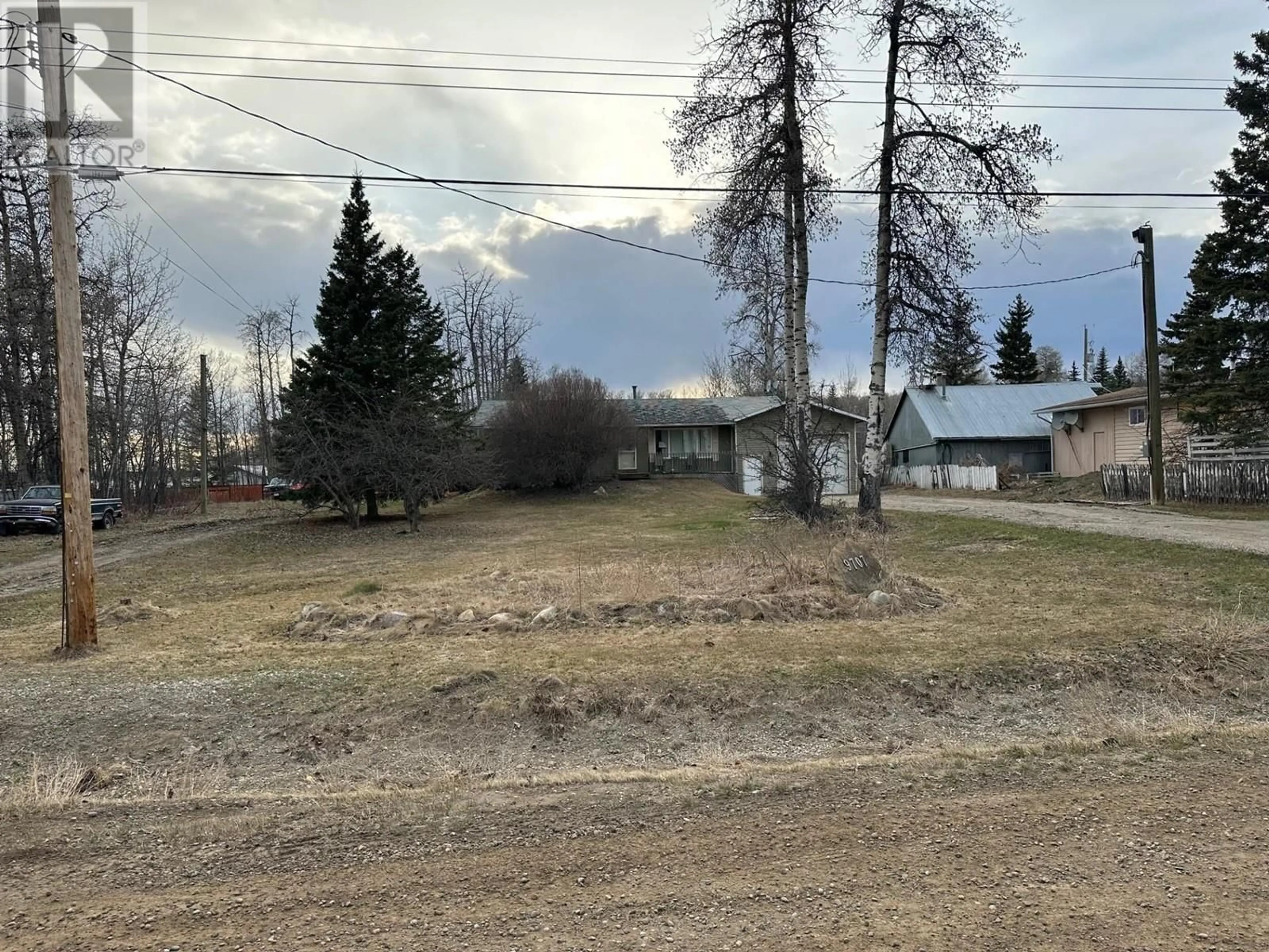 A pic from outside/outdoor area/front of a property/back of a property/a pic from drone, street for 9707 WILLOW ROAD, Fort St. John British Columbia V1J8A5
