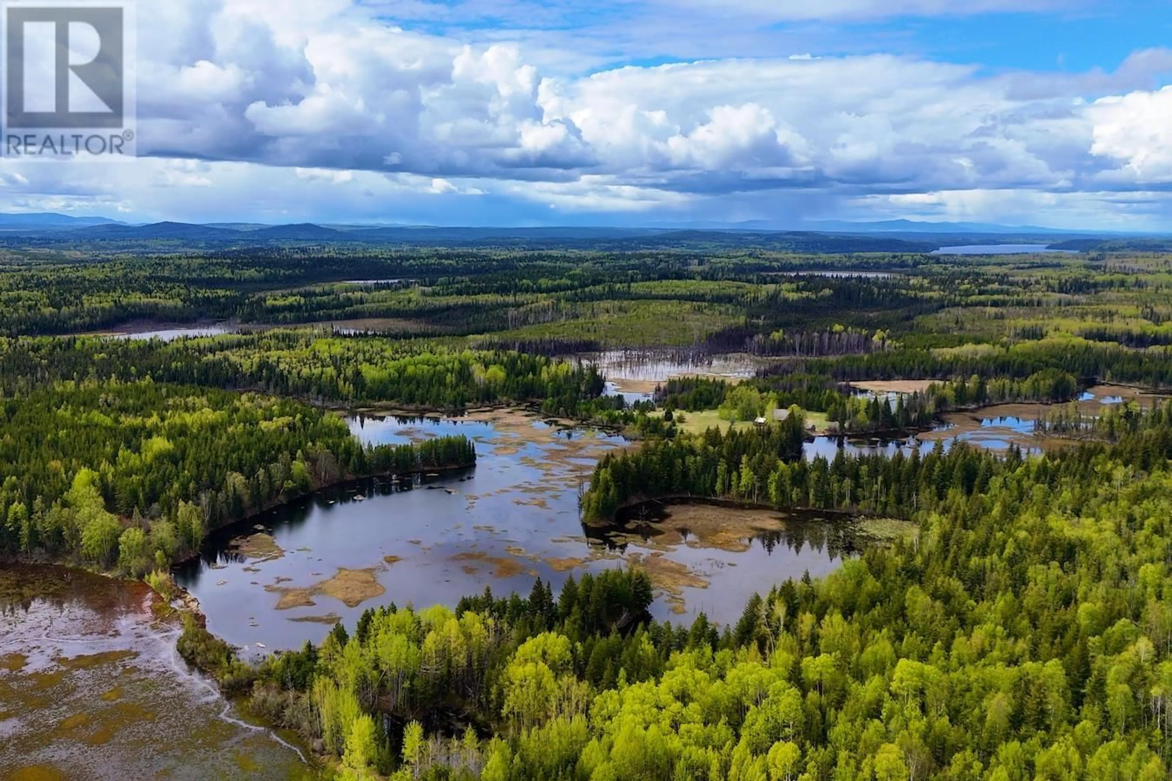 A pic from outside/outdoor area/front of a property/back of a property/a pic from drone, water/lake/river/ocean view for 12450 VIVIAN LAKE ROAD, Prince George British Columbia V2K5N2